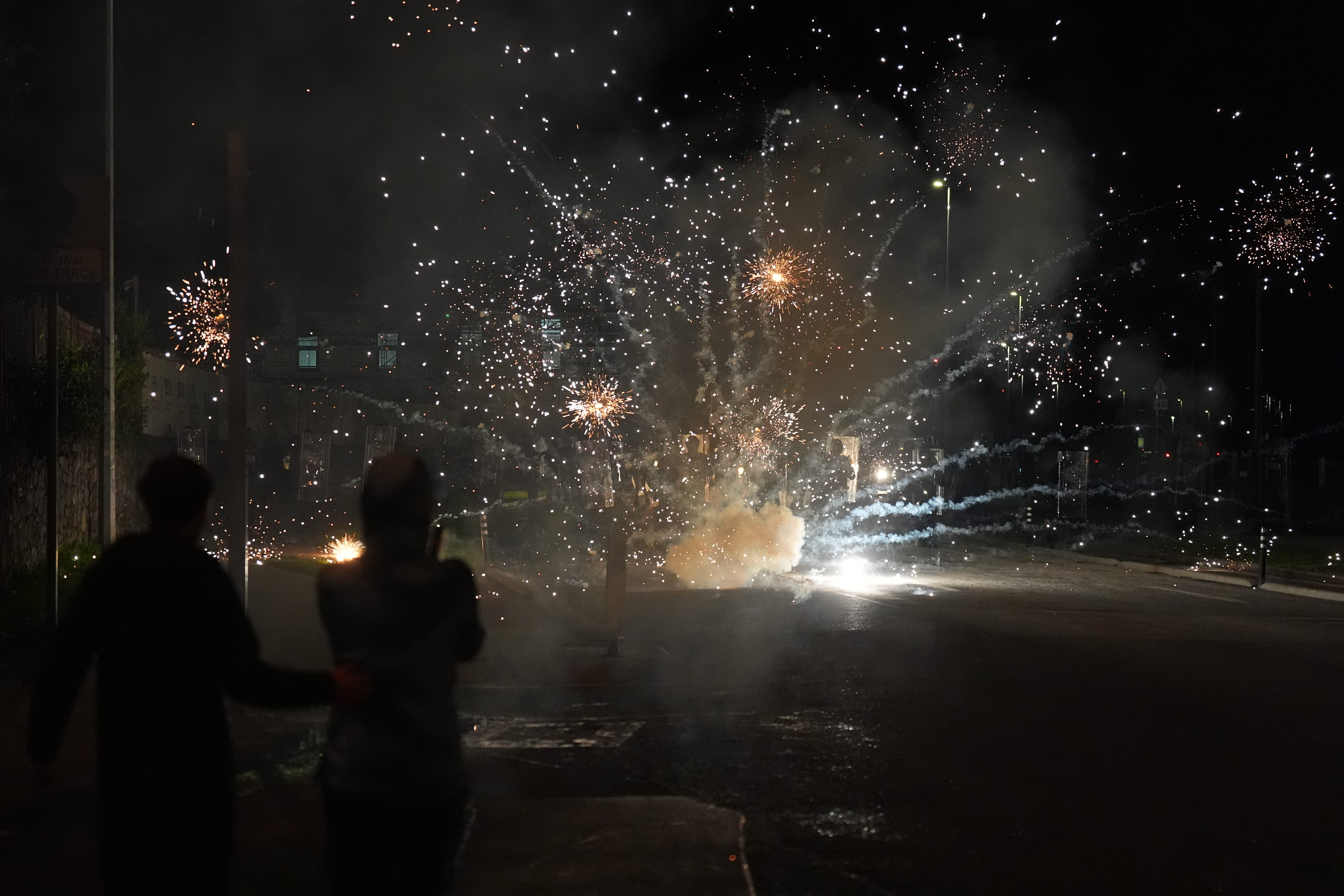 Protesters threw fireworks at officers near the Citywest Hotel (Niall Carson/PA)