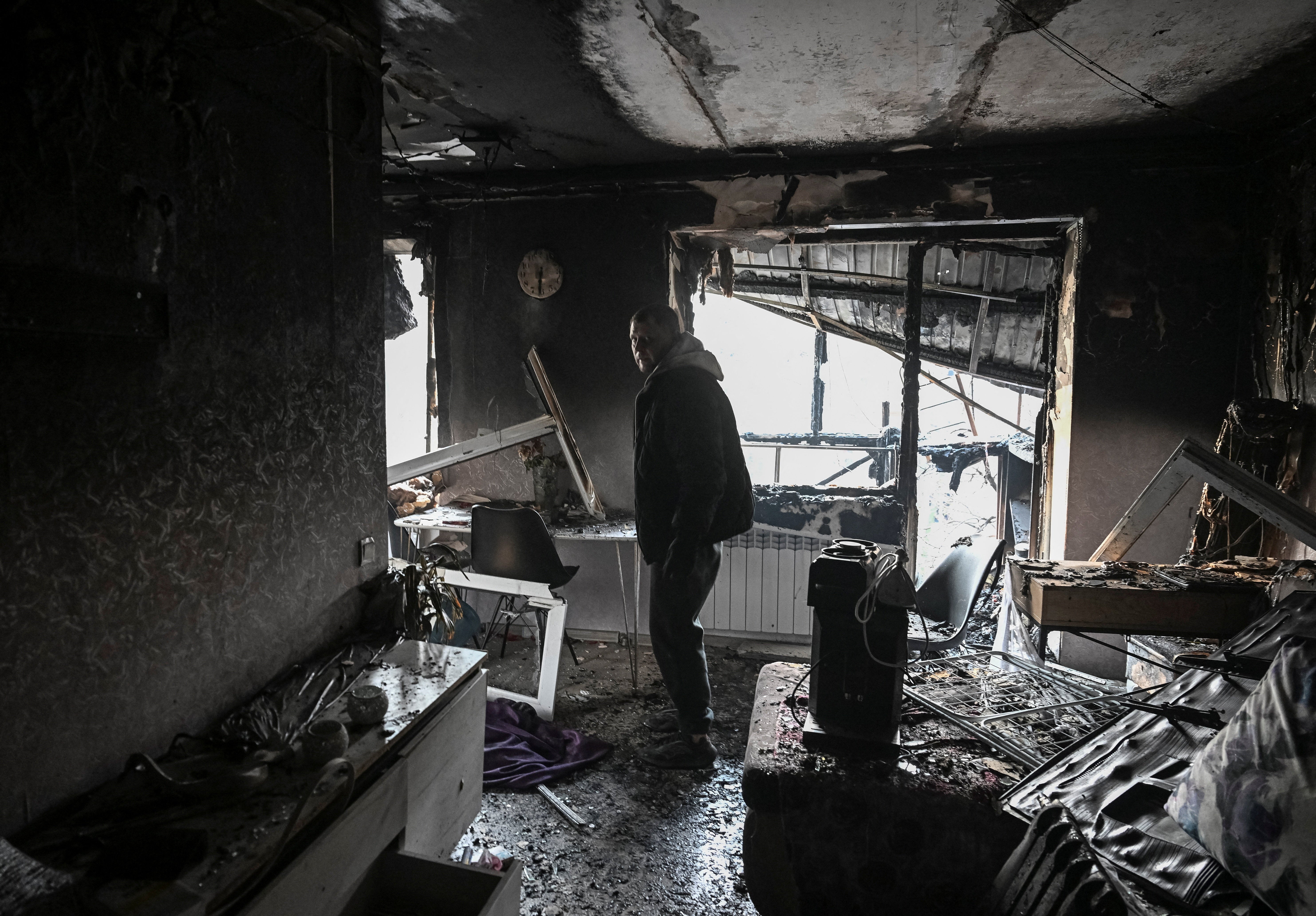 A resident visits his flat in a building damaged by a Russian drone strike in Zaporizhzhia this week