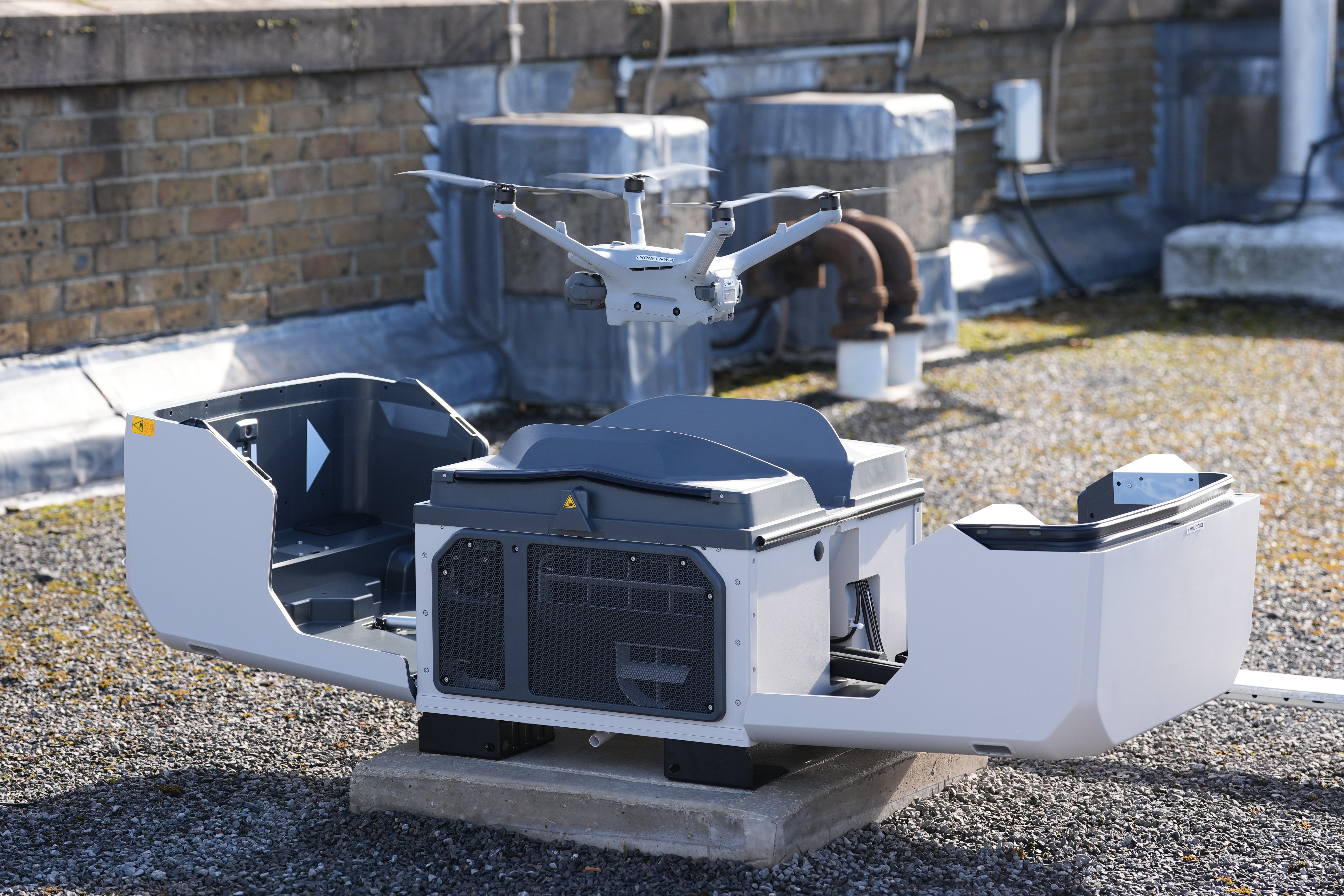 The drones sit in boxes on the roof of police buildings where they can charge before launch