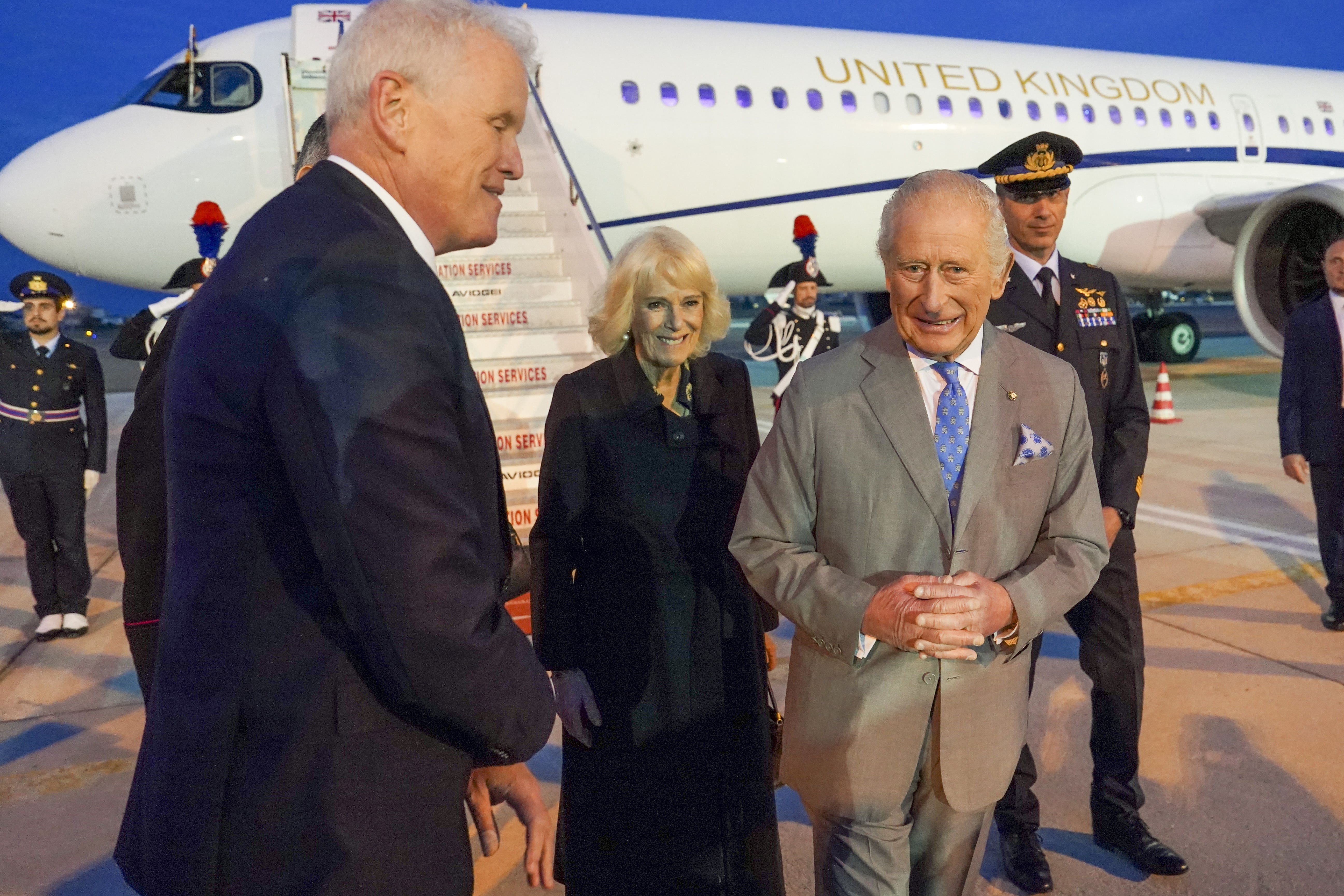 The King and Queen are greeted by Chris Trott, British ambassador to the Holy See, at Ciampino Airport in Rome (Arthur Edwards/The Sun/PA)
