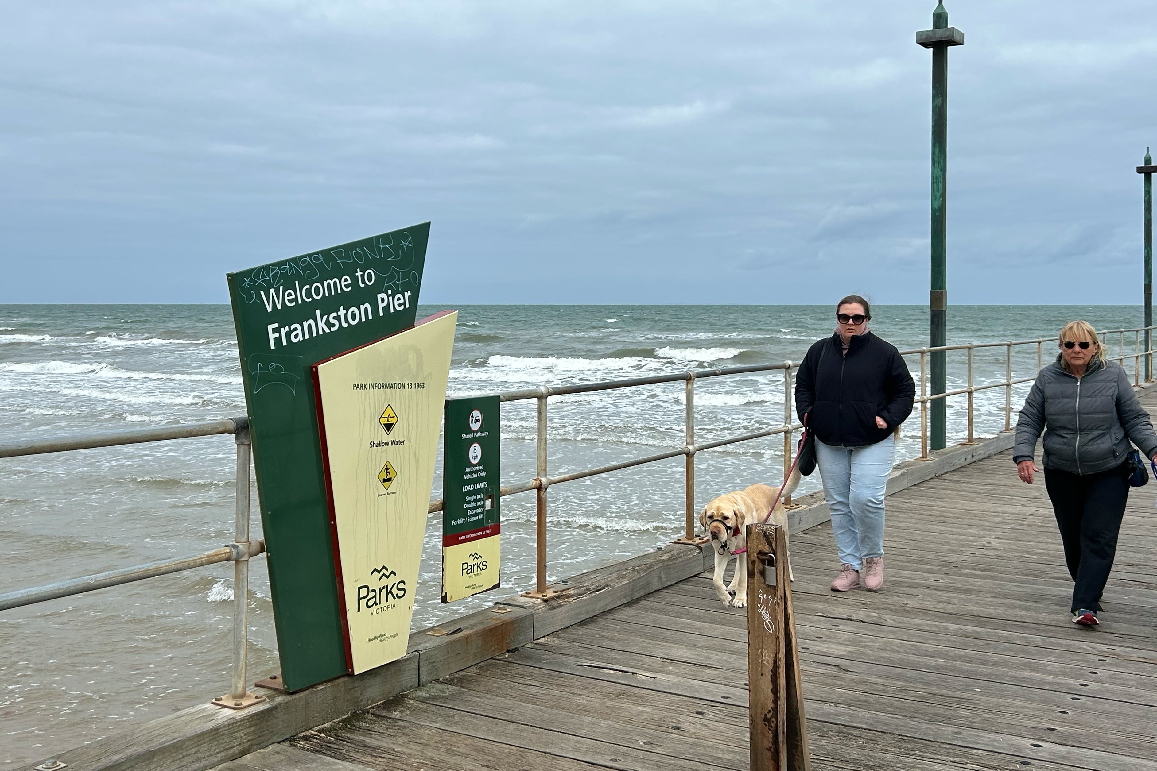 People walk on Frankston Pier in Melbourne, Australia, on Thursday, Oct. 23, 2025. (AP Photo/Rod McGuirk)