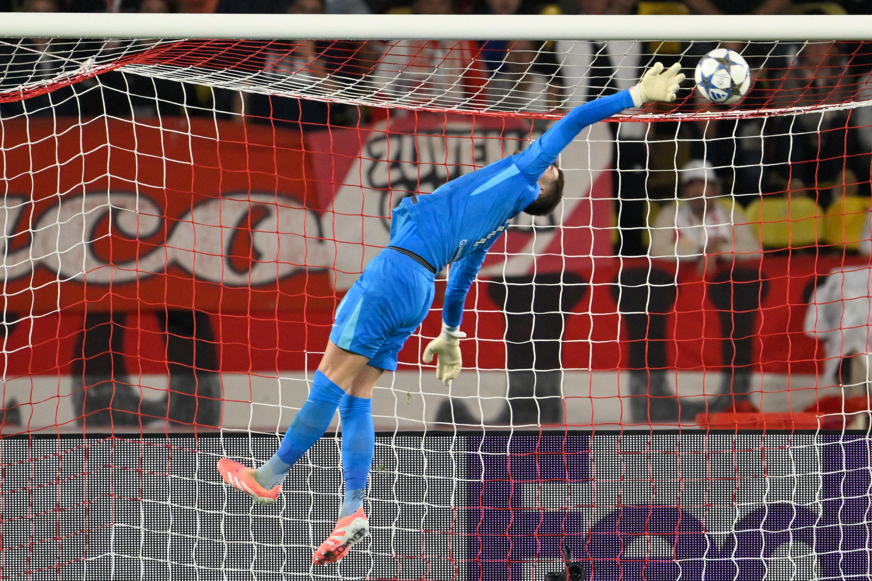 Tottenham goalkeeper Guglielmo Vicario makes a save against Monaco (Philippe Magoni/AP)