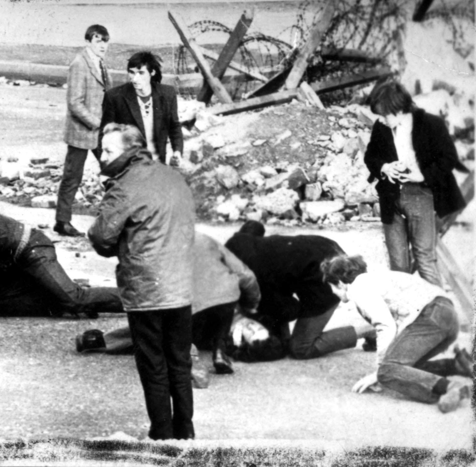 A man receives attention during Bloody Sunday