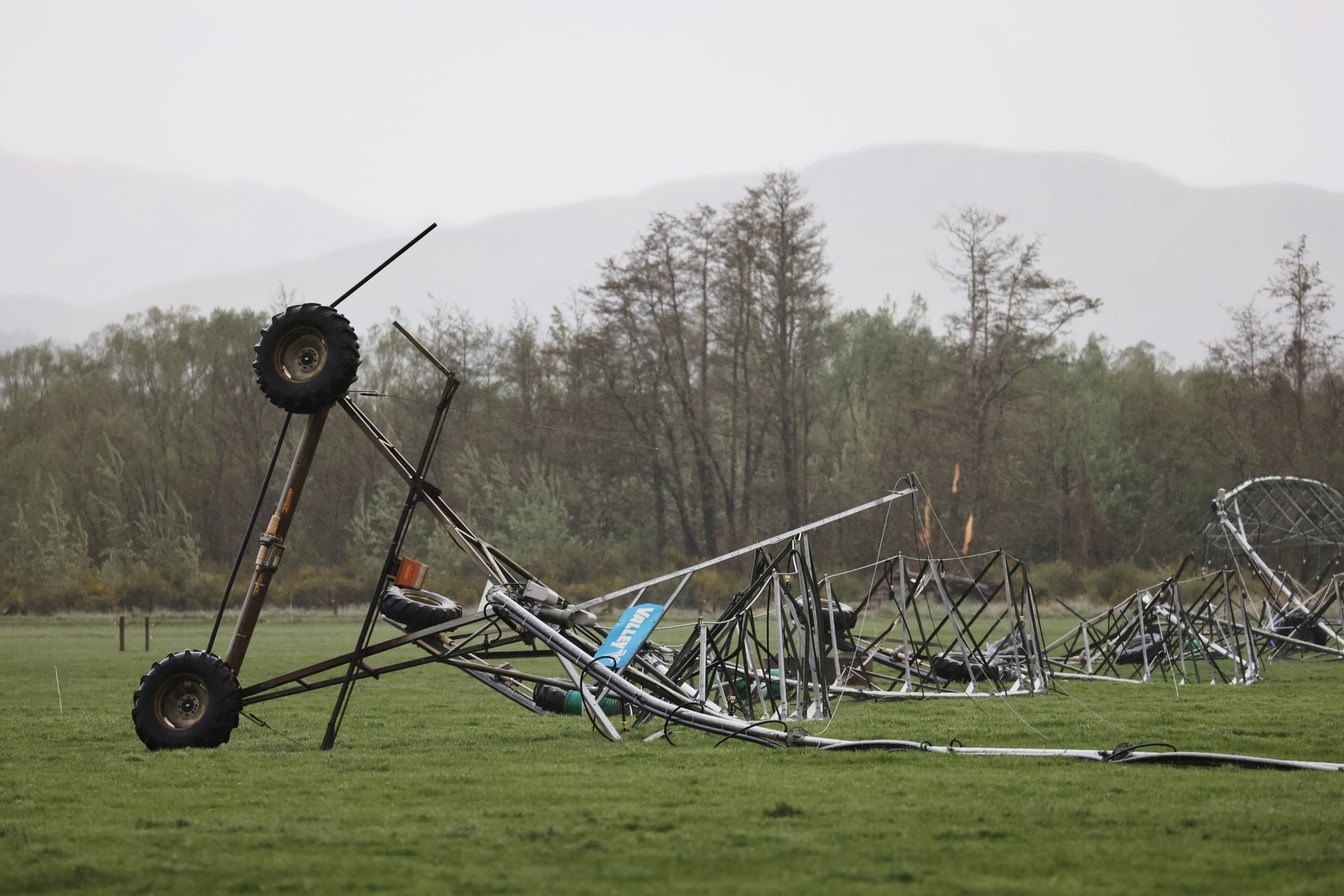 Farm irrigation equipment on the ground after it was damaged by strong winds in Waiau, New Zealand, on Thursday