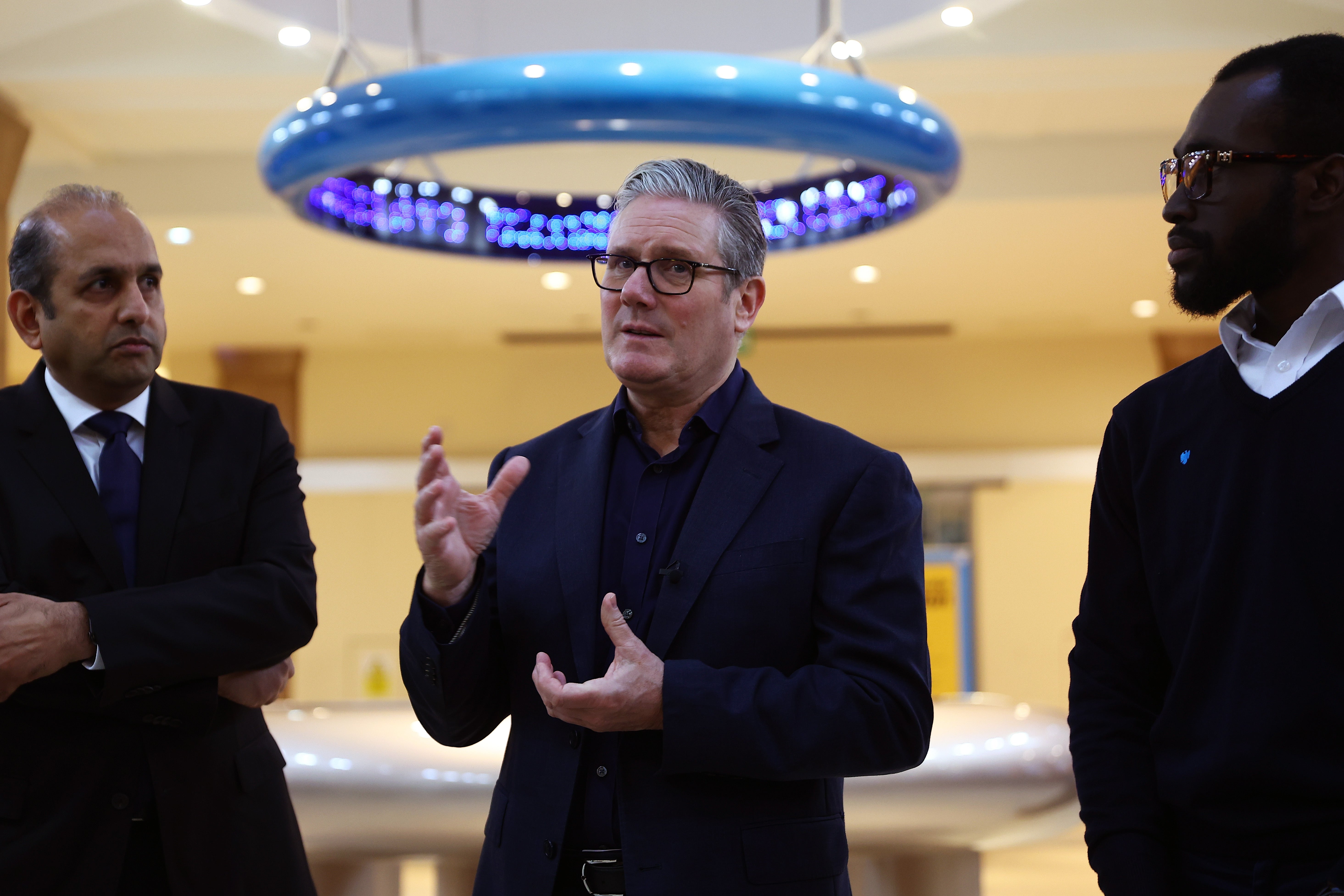 Prime Minister Sir Keir Starmer discusses digital IDs with employees of Barclays in Brighton (Pete Nicholls/PA)