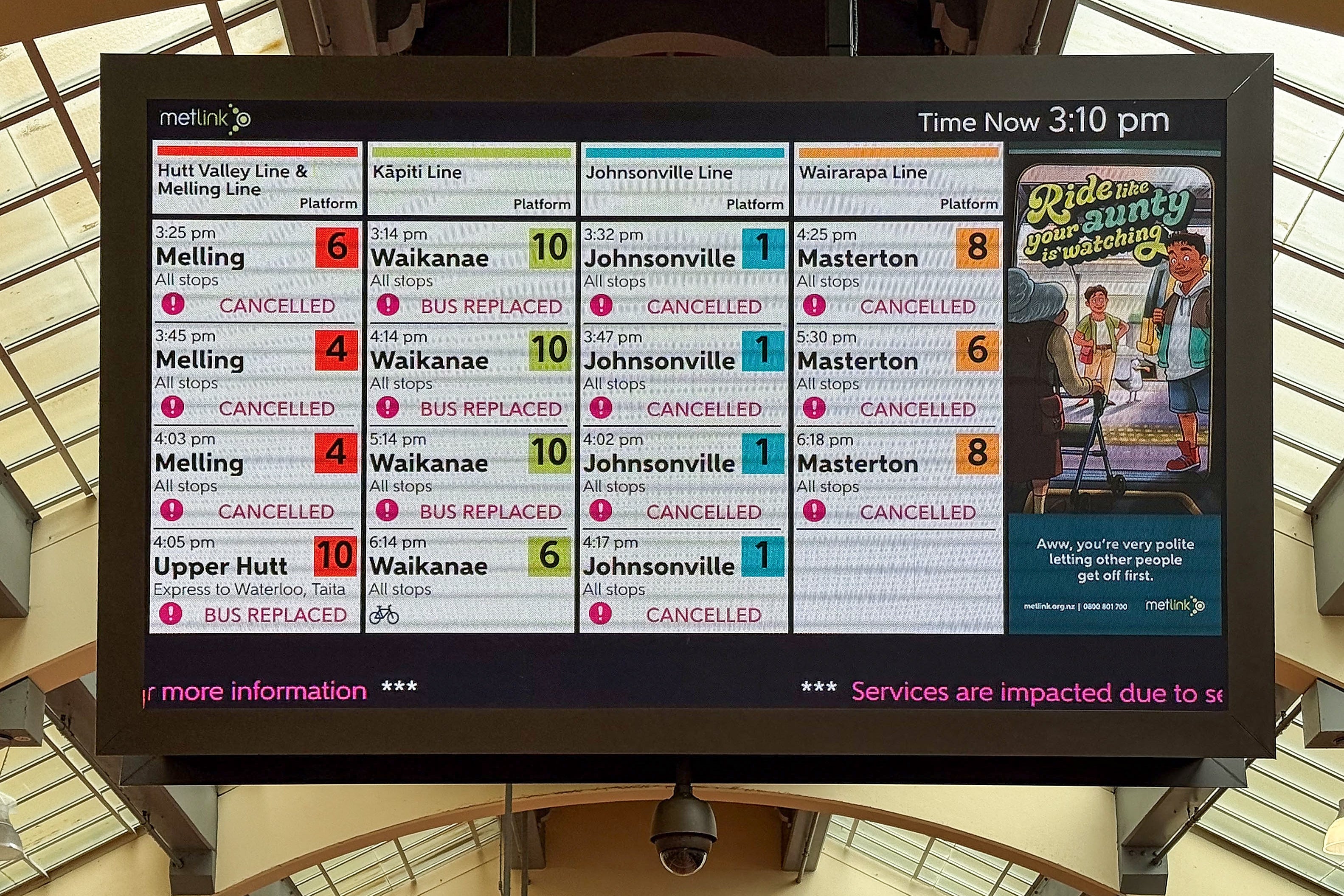 A screen at Wellington's central railway station shows cancelled trips during a rare red wind warning