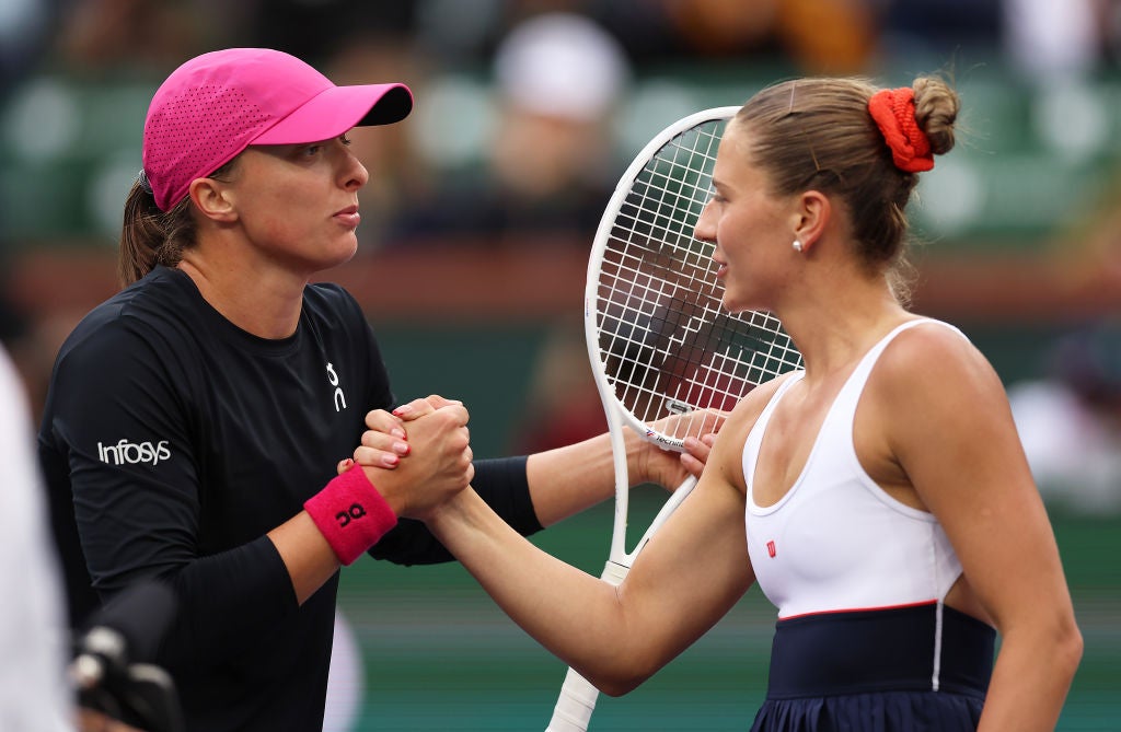 Kostyuk is listed at the same height as Swiatek