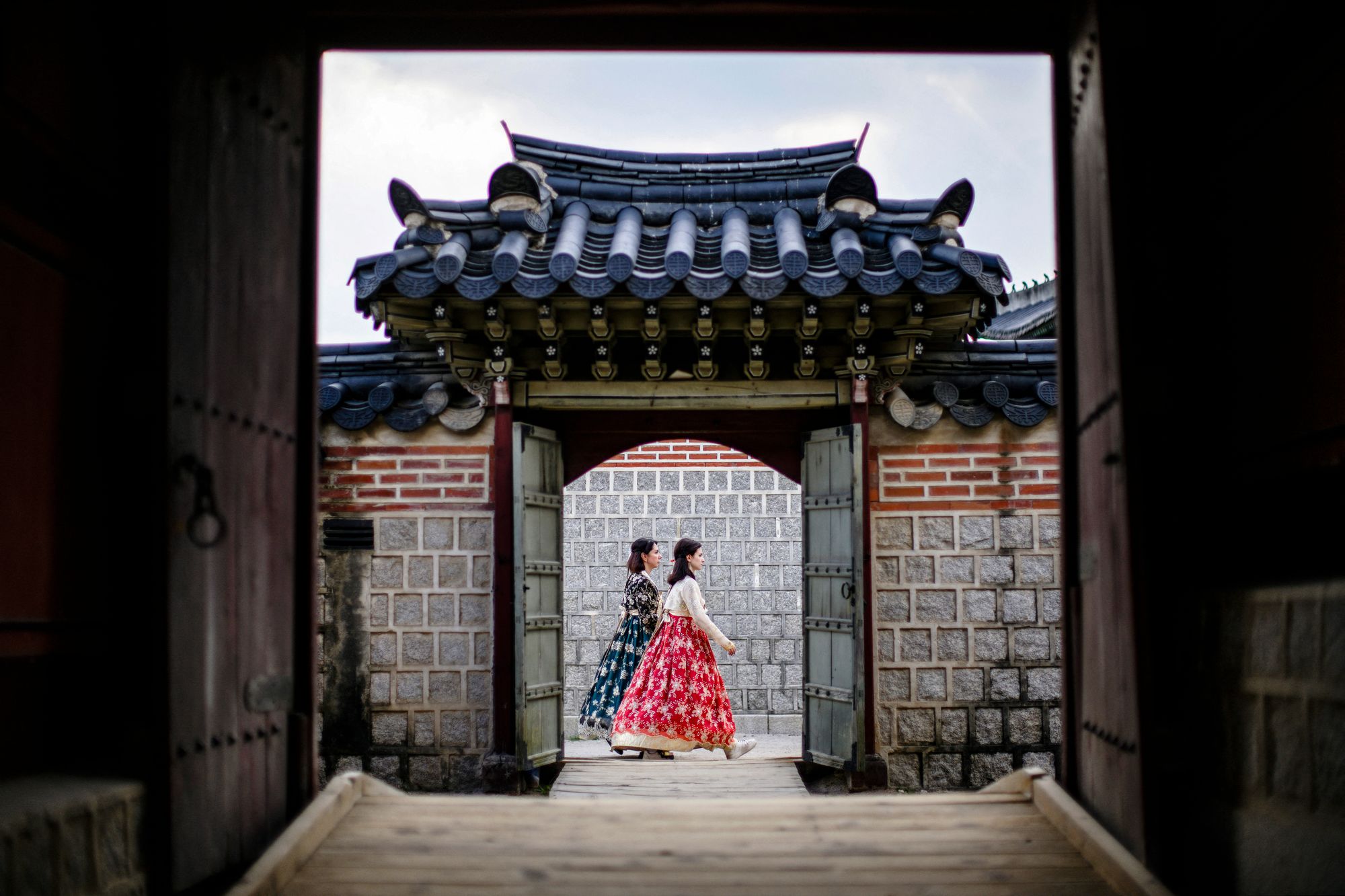 Women wearing traditional hanbok dresses visit the Gyeongbokgung Palace in Seoul on August 19, 2024