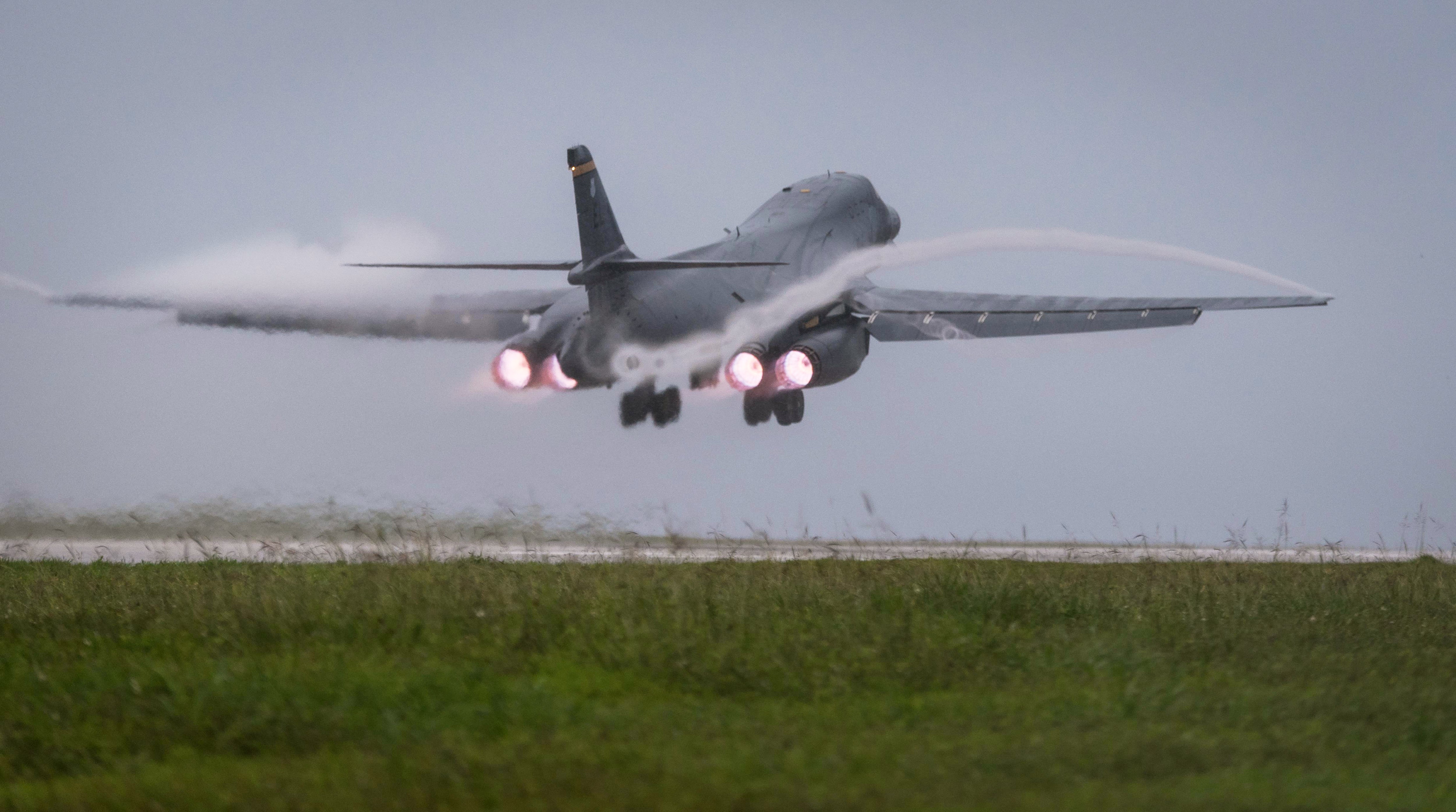 In this photo released by the U.S. Air Force, a Air Force B-1B Lancer bomber takes off from Andersen Air Force Base, Guam, to fly a mission with two Koku Jieitai (Japan Air Self-Defense Force) F-15s, Sept. 9, 2017. (Senior Airman Jacob Skovo/U.S. Air Force via AP)