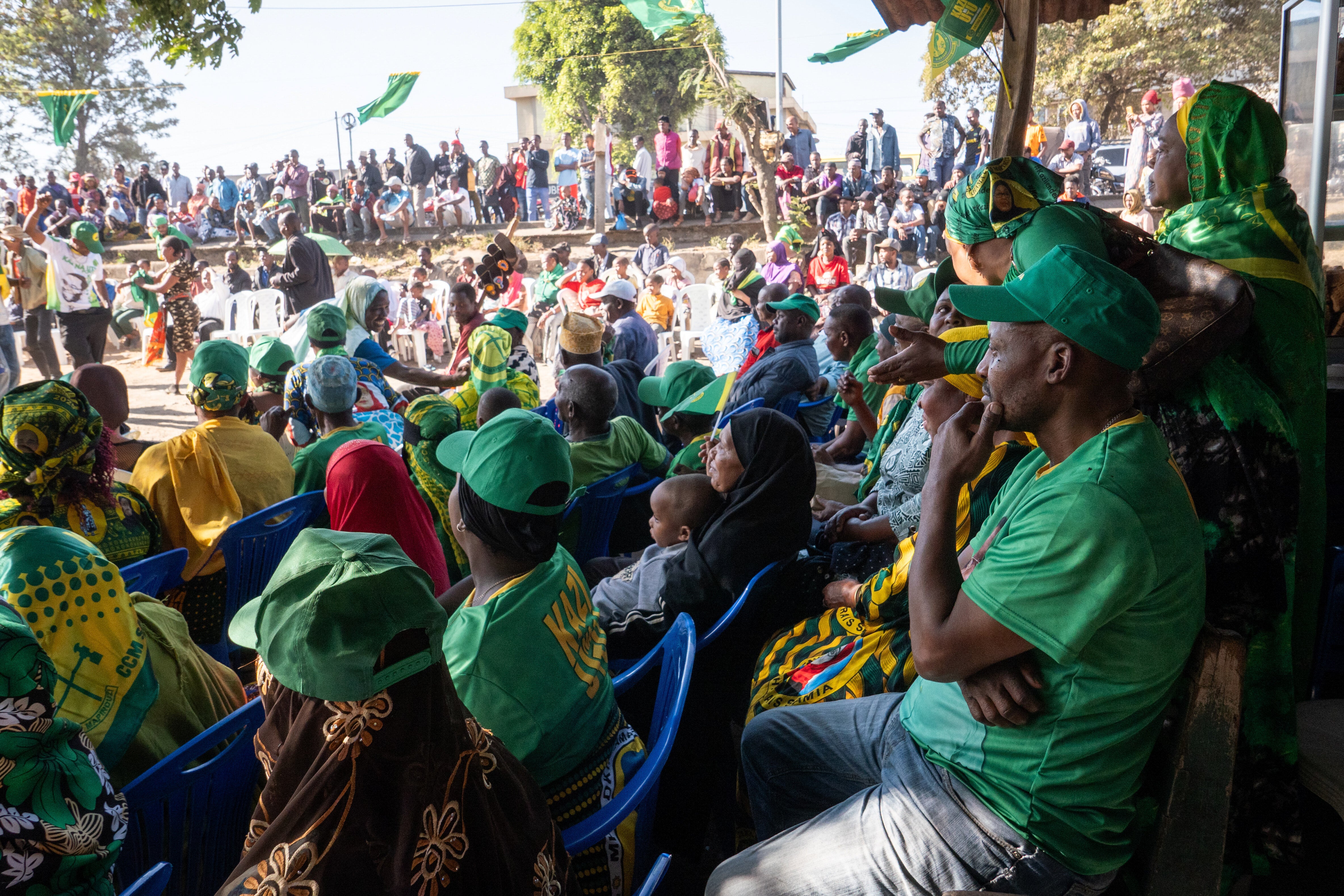 Supporters of Tanzanian presidential candidate Samia Suluhu Hassan, of the ruling Chama Cha Mapinduzi party, listen to speeches during a campaign rally in Arusha, Tanzania
