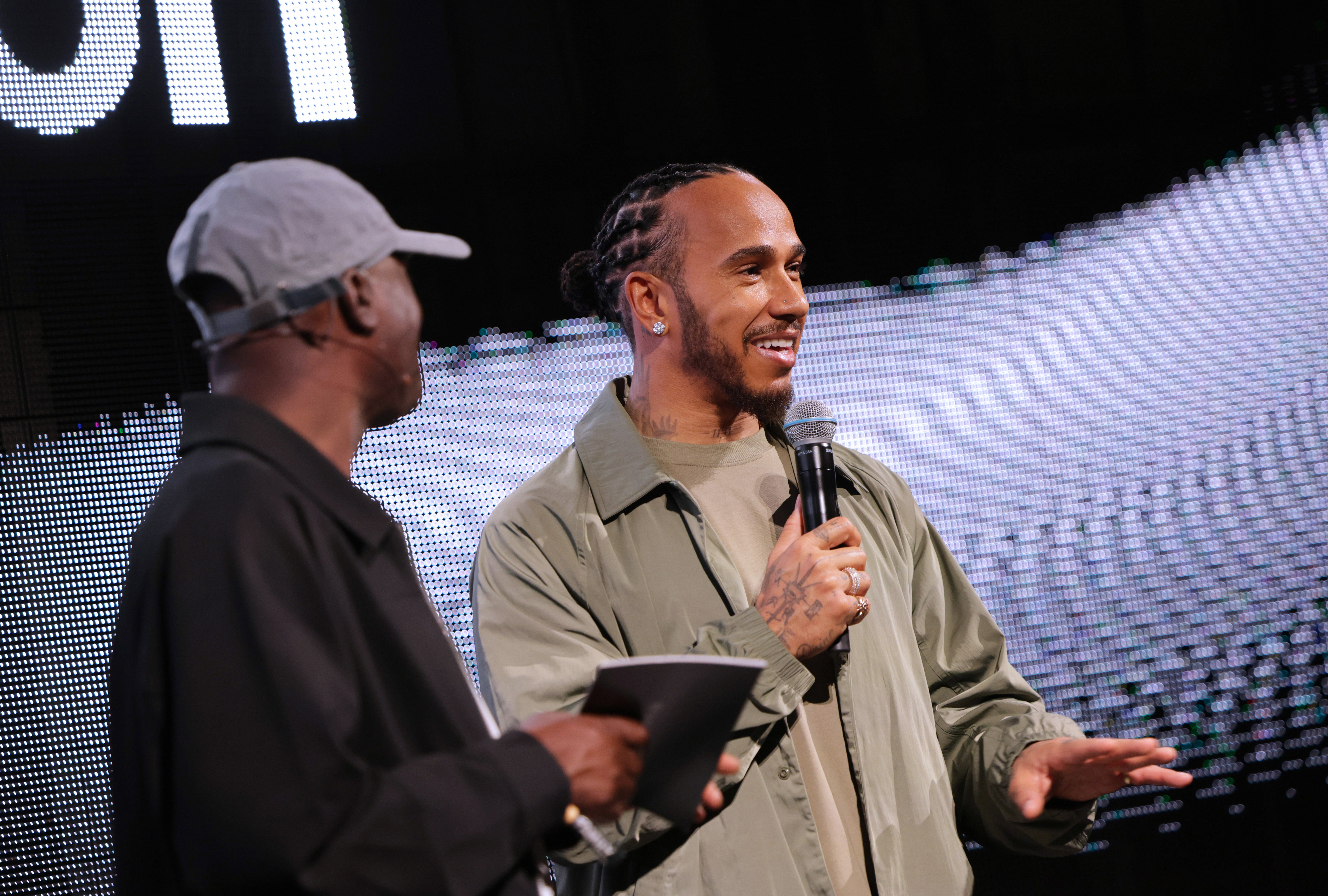 Lululemon ambassador Lewis Hamilton speaking at the brand's event in London