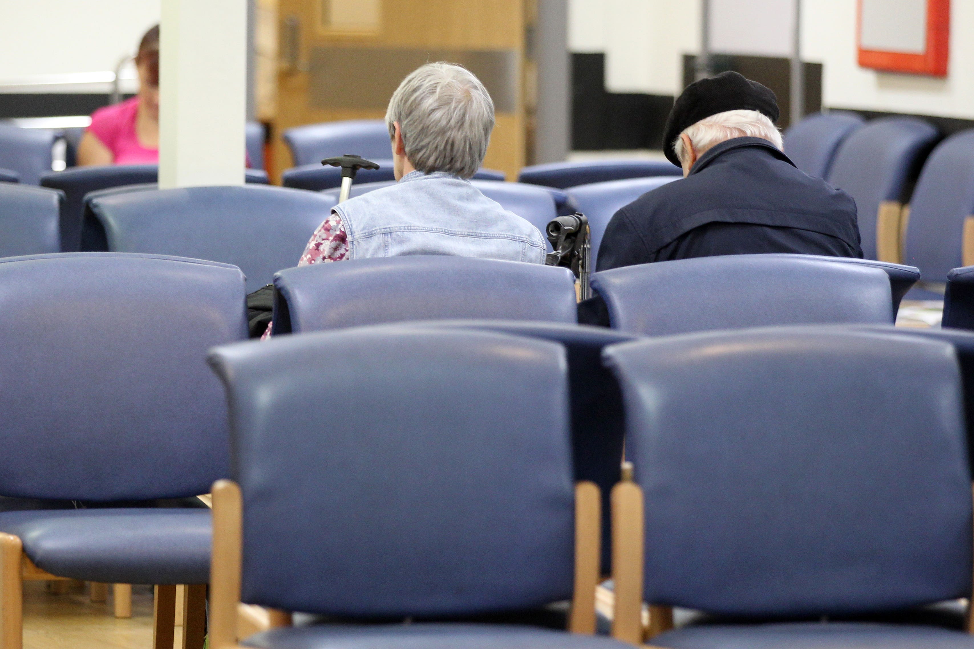 Patients in a waiting room (Lynne Cameron/PA)