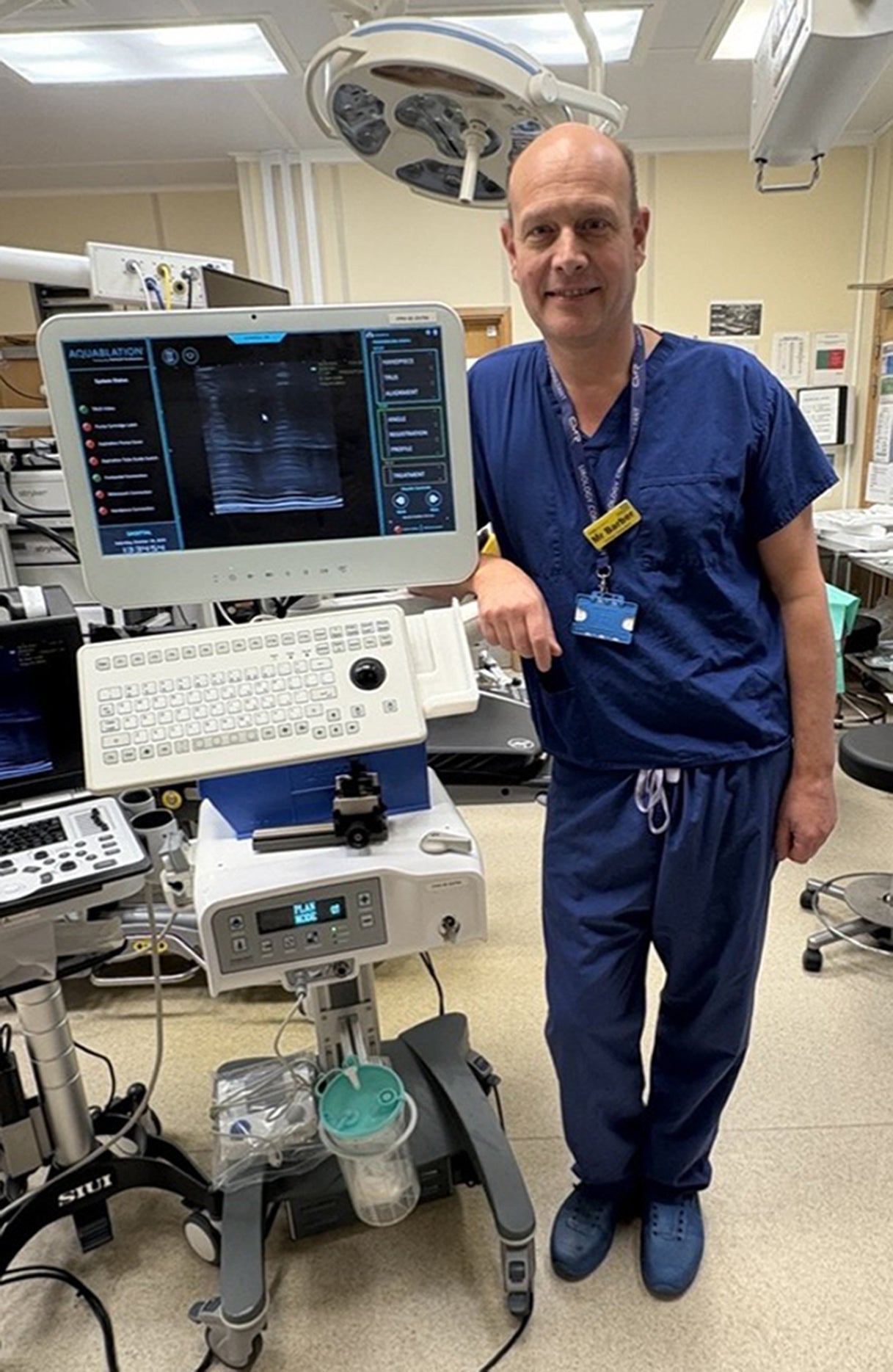 Neil Barber, consultant urological surgeon and clinical lead for urology at Frimley Health NHS Foundation Trust, with an Aquablation machine
