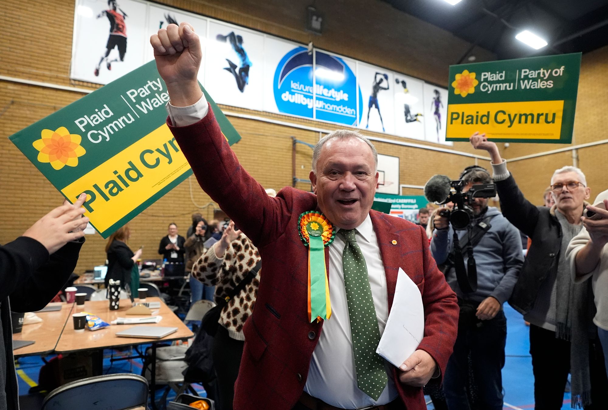 Plaid Cymru’s Lindsay Whittle celebrates after being declared winner of the Caerphilly by-election