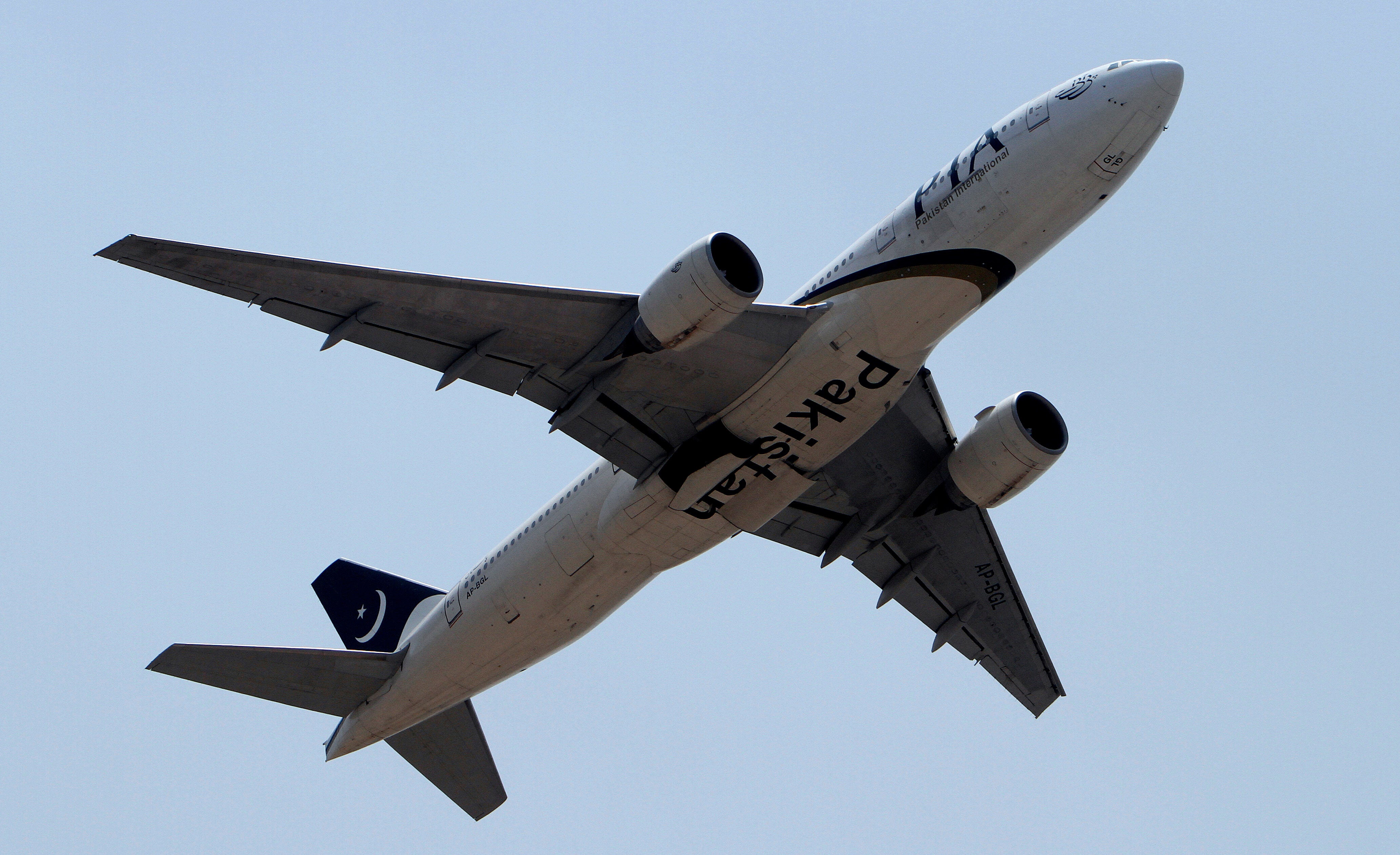 In this June 8, 2013 photo, a Pakistani International Airline plane takes off from Benazir Bhutto airport in Islamabad, Pakistan. (AP Photo/Anjum Naveed, File)