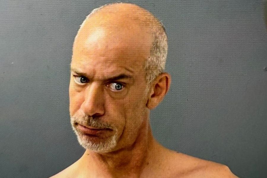 Corey Nickerson, 50, pleaded not guilty to assault and other charges as newly-released surveillance video allegedly showed him attacking two New Hampshire 911 dispatchers