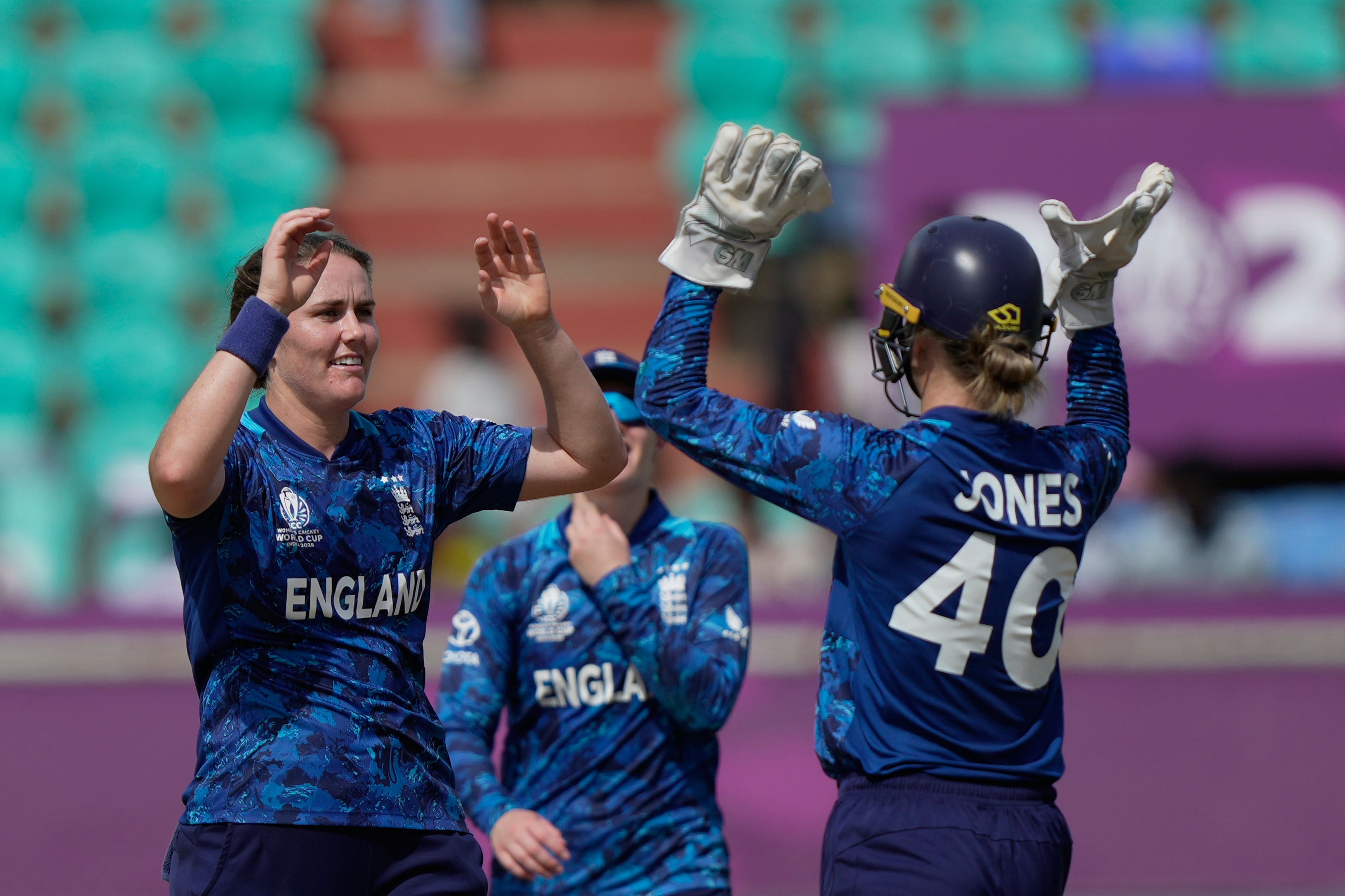 England captain Nat Sciver-Brunt celebrates with Amy Jones after taking the wicket of New Zealand batter Rosemary Mair during their World Cup victory in India (Mahesh Kumar AP)
