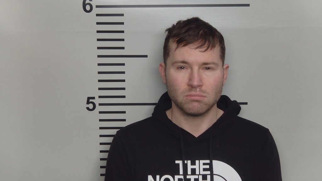 Booth was charged with at least 20 counts of distributing matter portraying sexual performance by a minor