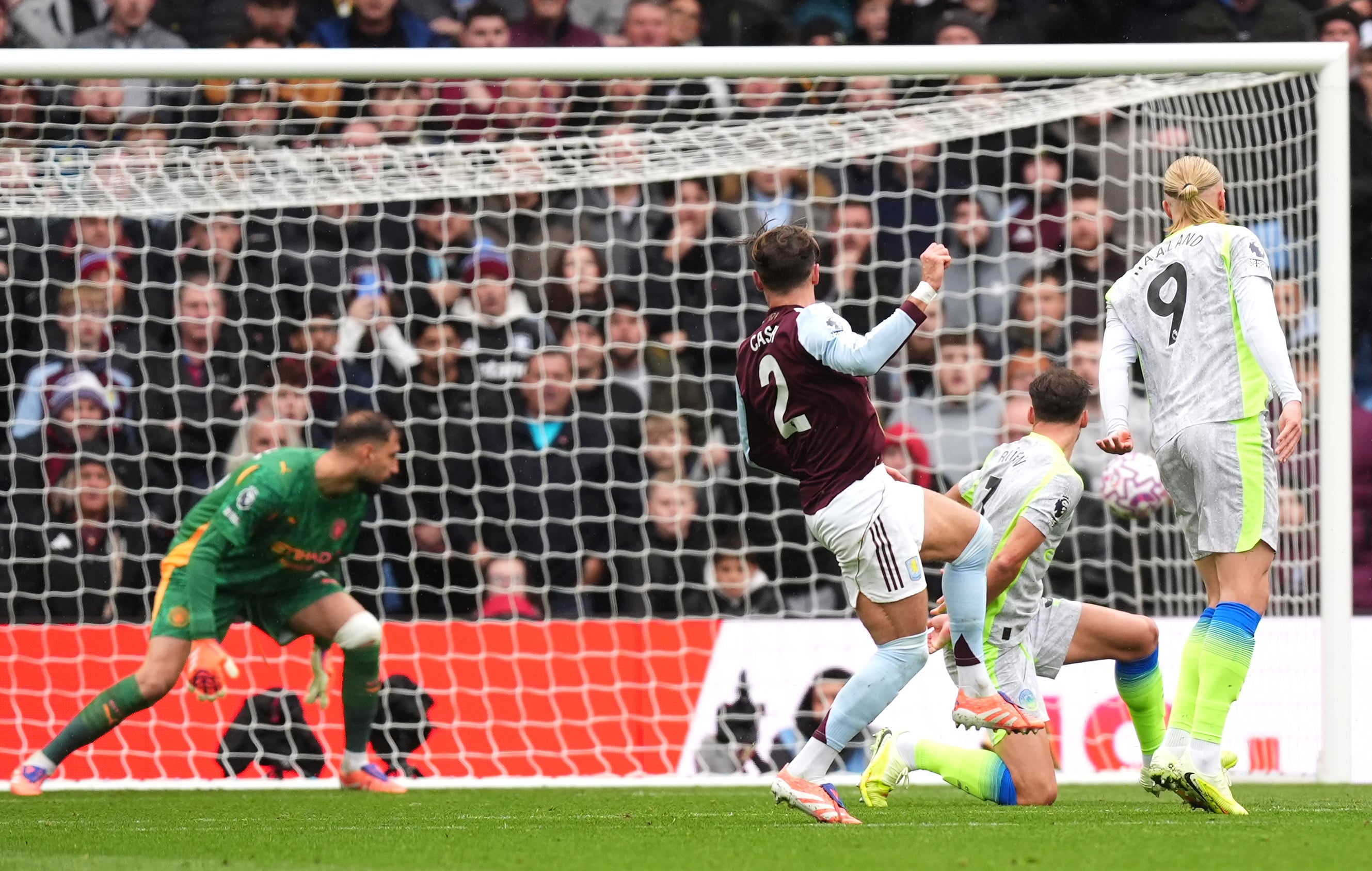 Aston Villa’s Matty Cash, centre, made the decisive breakthrough with this shot (Mike Egerton/PA)