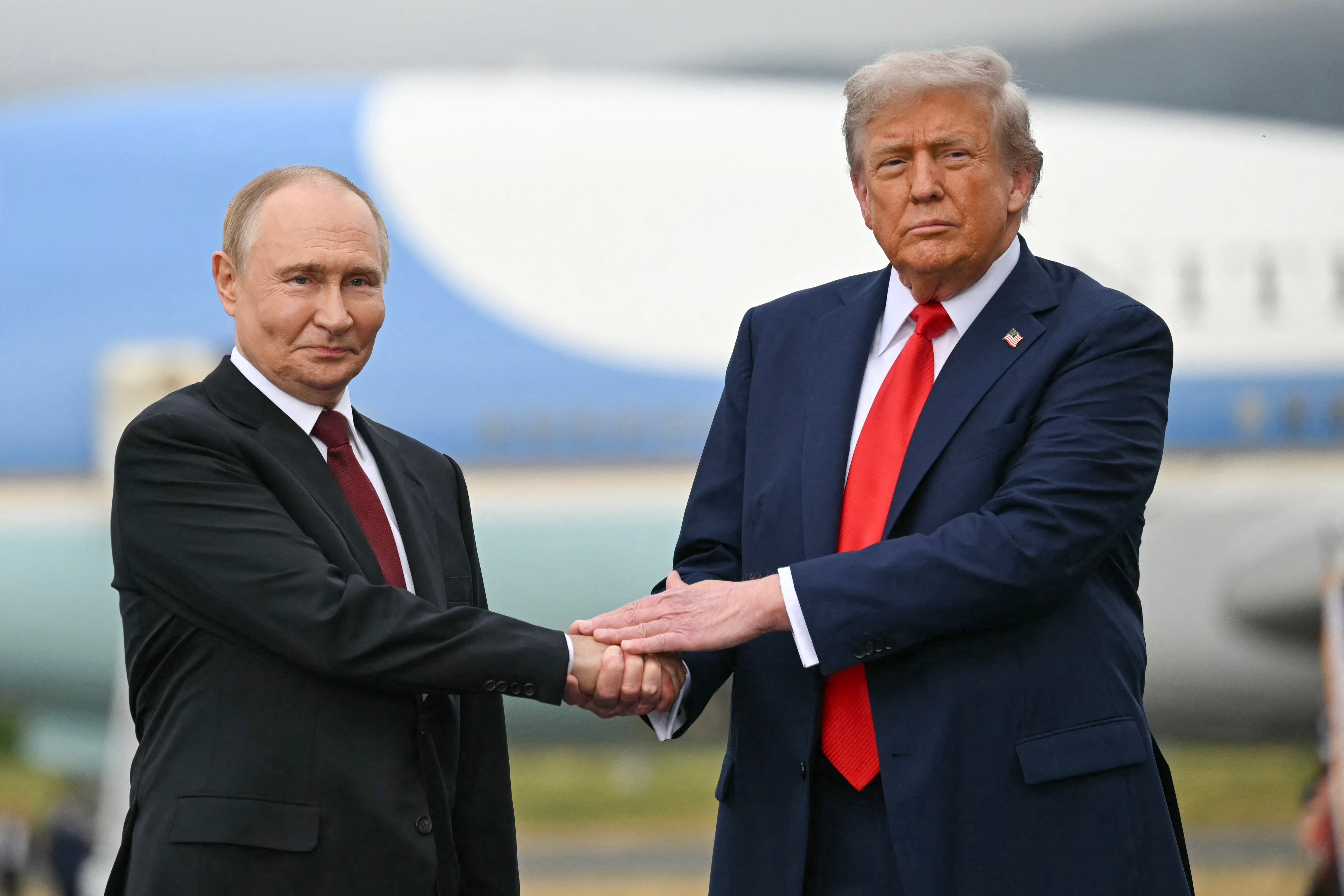 Donald Trump greets Russian President Vladimir Putin in Alaska last August. The new ‘peace’ plan has been roundly criticised for favouring Russia