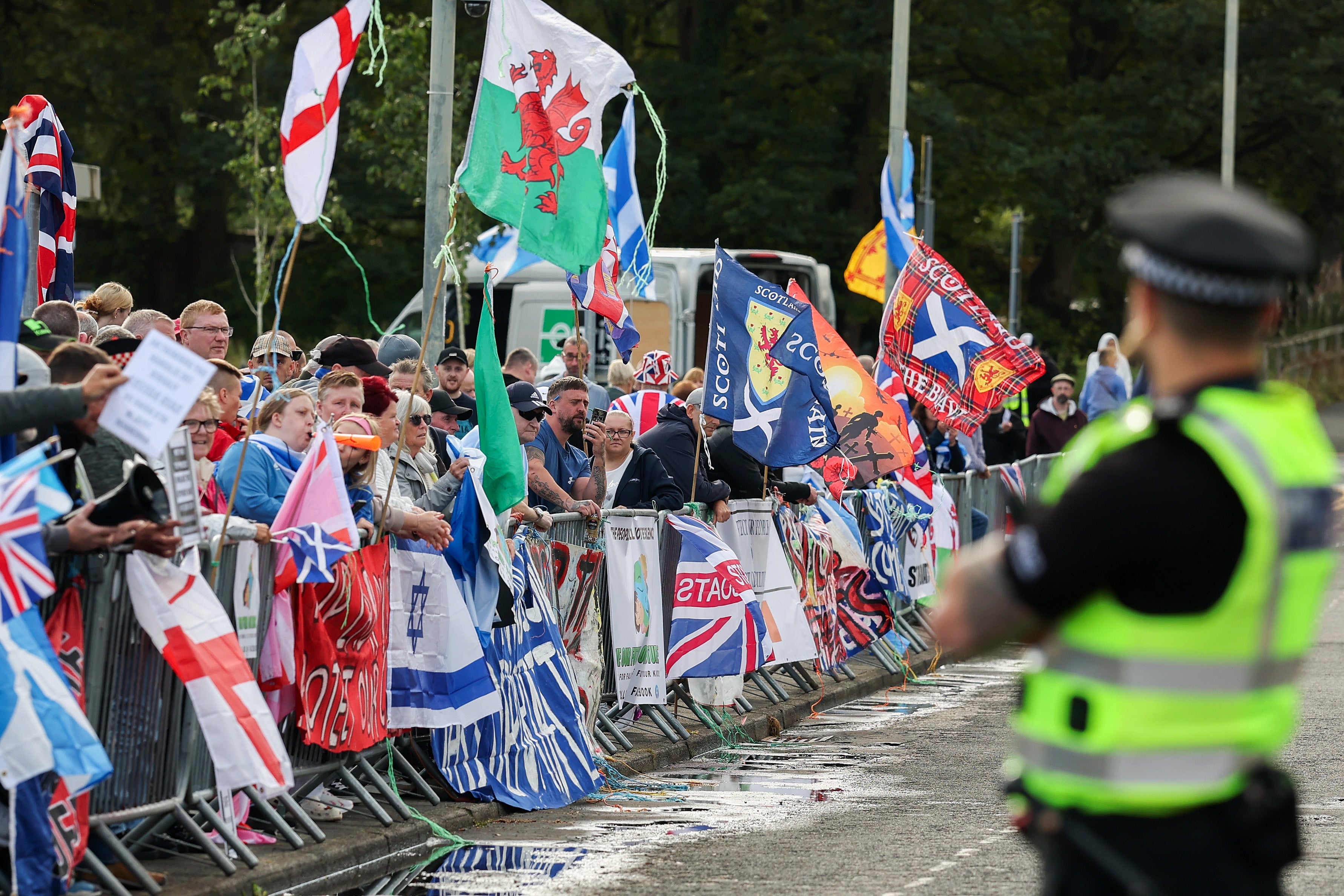 Anti-migrant protesters outside the Cladhan Hotel, Scotland, in September