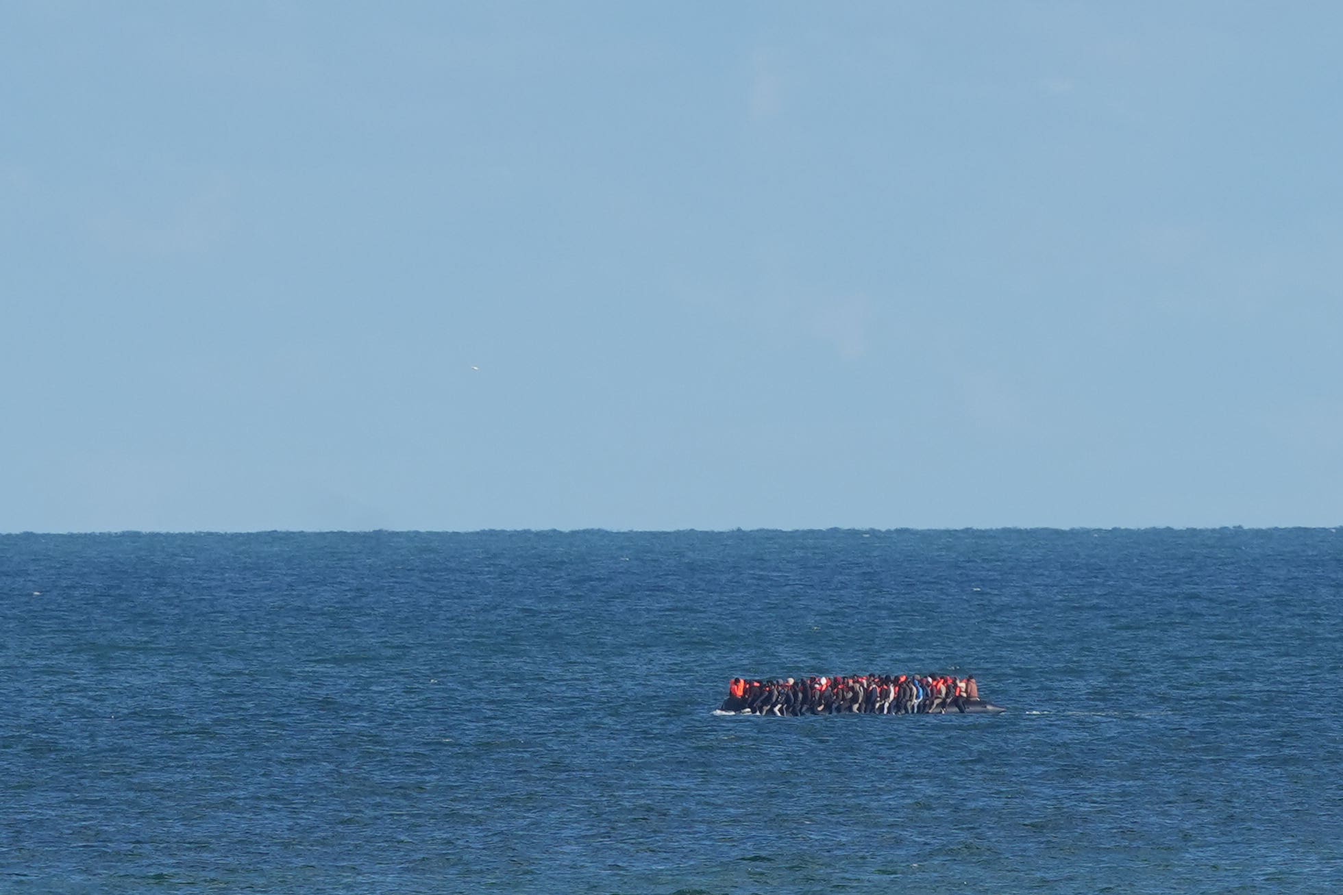 A group of people believed to be migrants on board a small boat attempt to cross the Channel (file image)