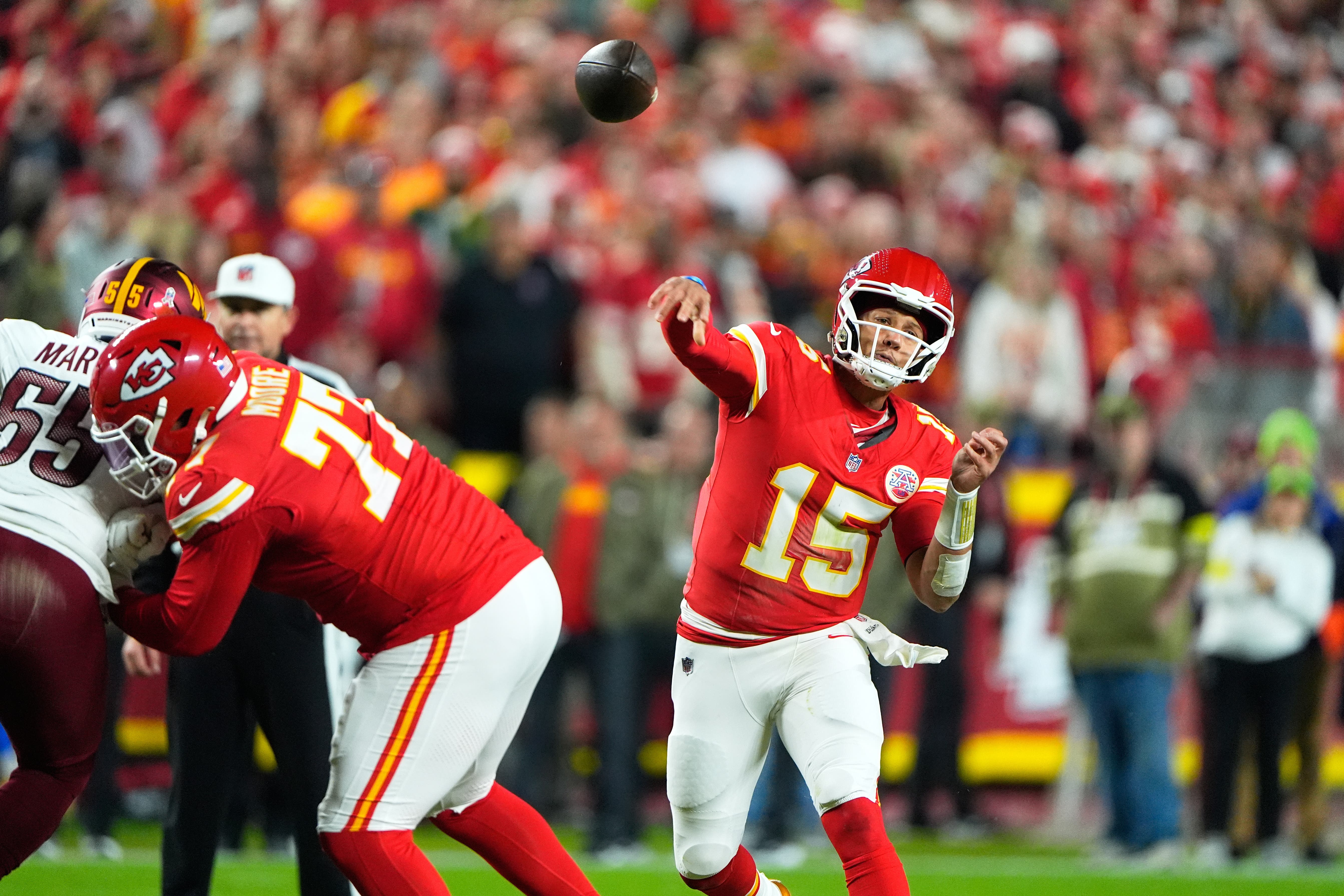 Kansas City Chiefs quarterback Patrick Mahomes (15) throws during the first half of an NFL football game against the Washington Commanders (Charlie Riedel/AP)