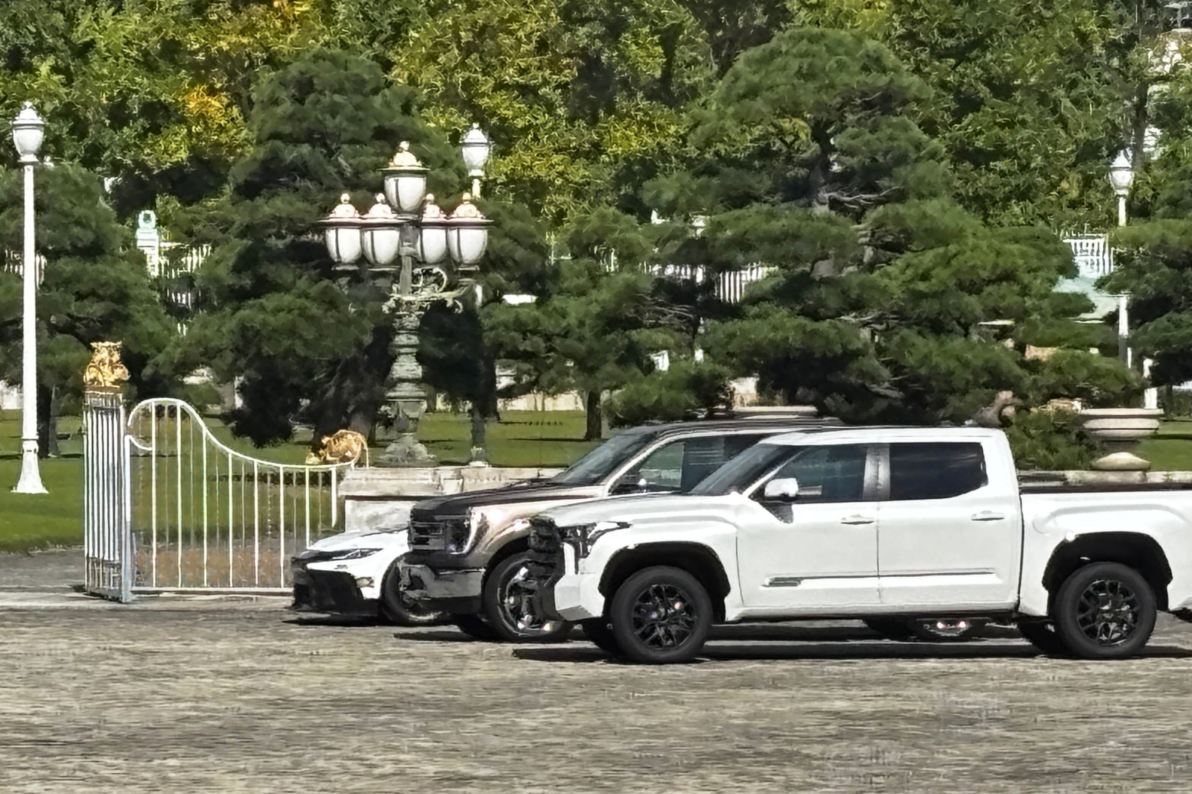 A Ford F-150, center, and two other American-made cars sit parked outside the Akasaka Palace, Tokyo's guest house for visiting foreign leaders, in Minato, Japan, Monday, Oct. 27, 2025, as President Donald Trump meets Japan's Prime Minister Sanae Takaichi