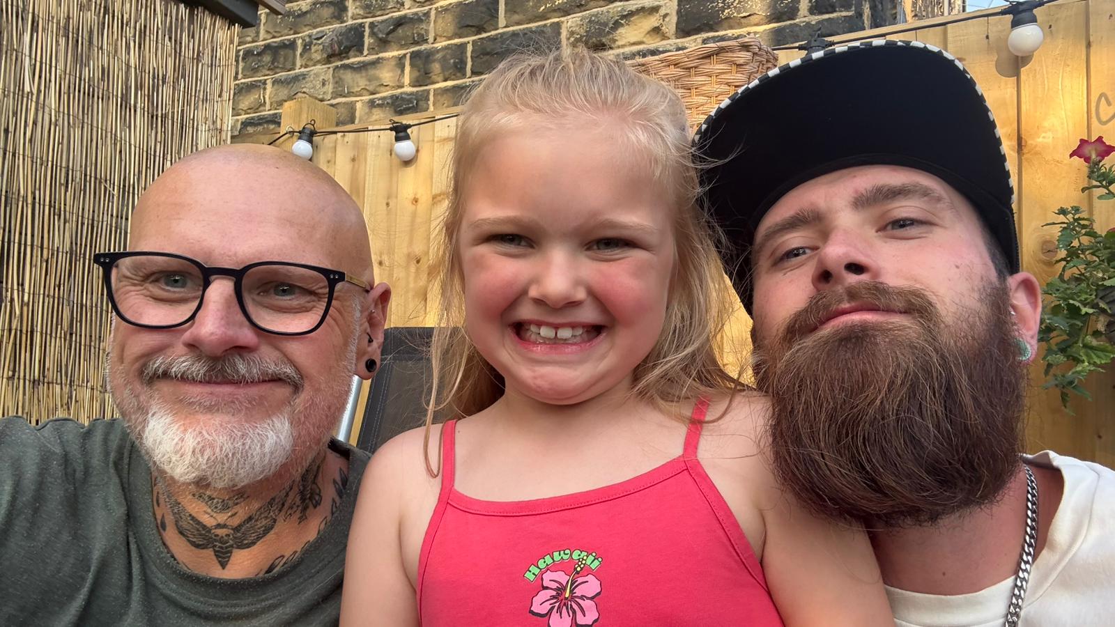 Mr Spurr, his son Josh (right) and granddaughter Hailey (centre) recreated a family photo now he has nearly reached his goal weight