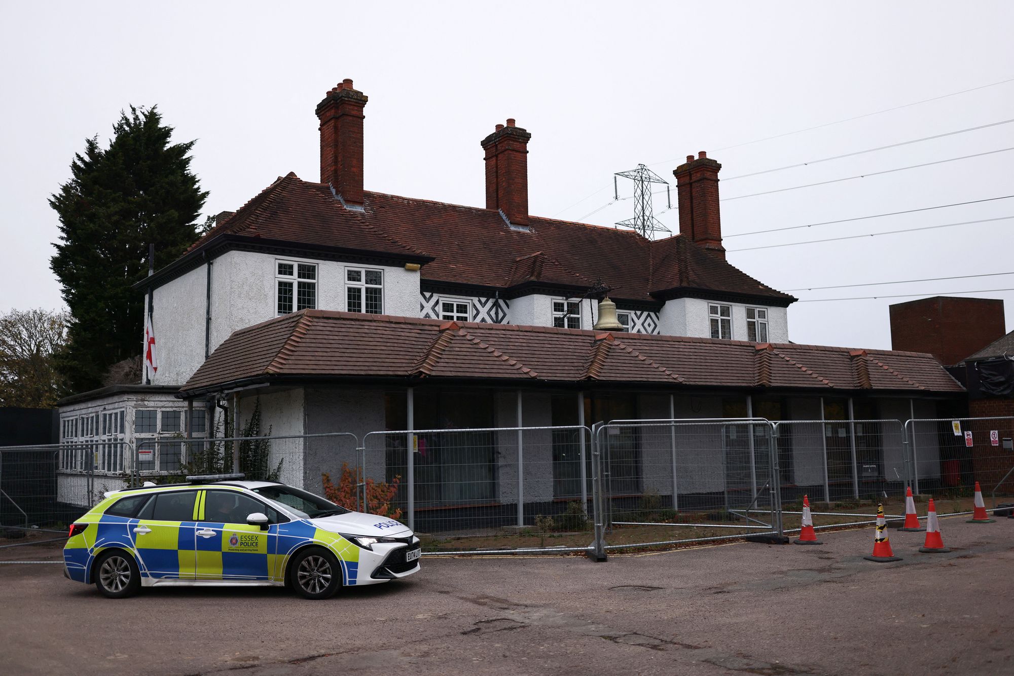 Police stationed outside The Bell Hotel, as demonstrators protest nearby