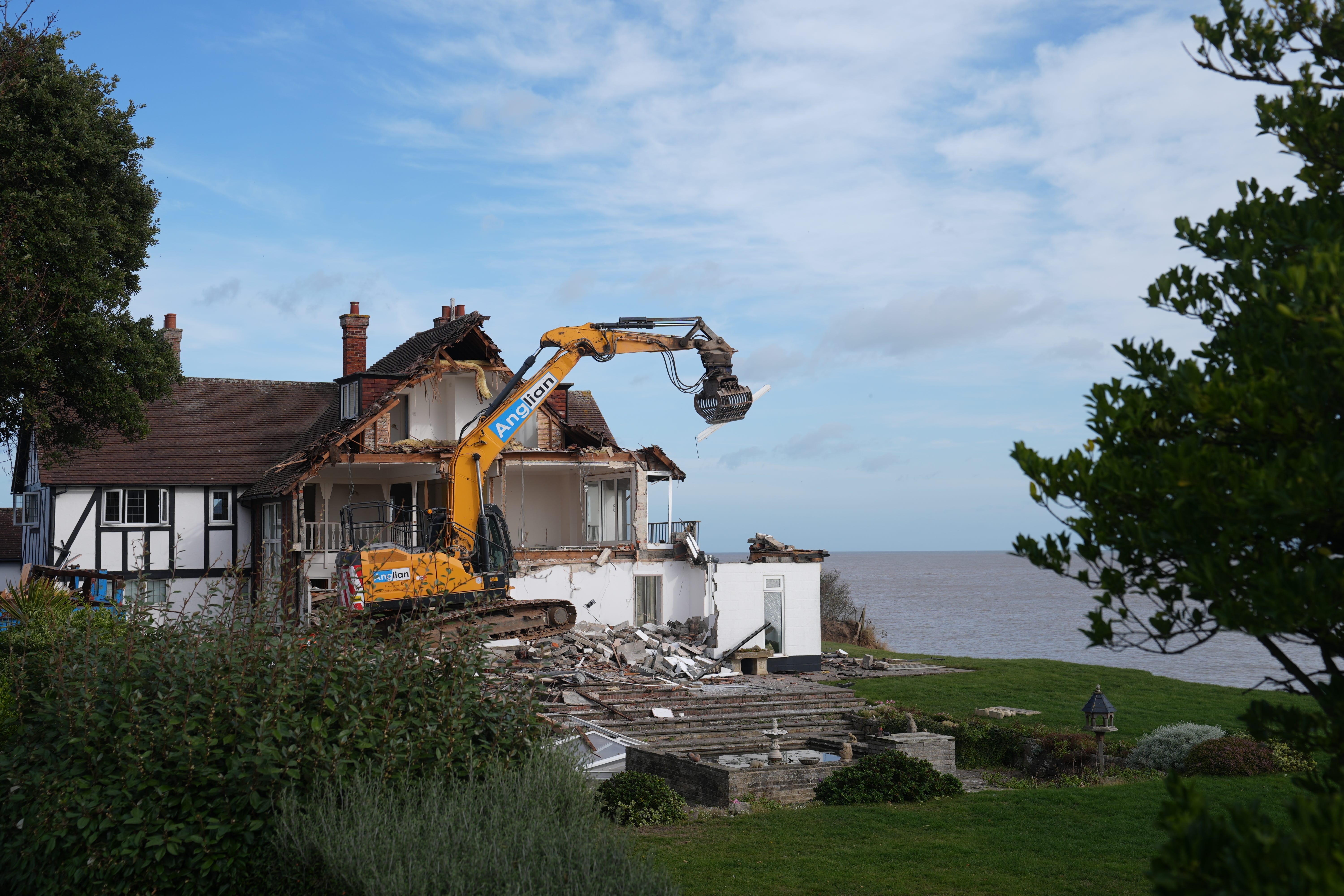 Demolition begins on Jean Flick’s clifftop home in Thorpeness, Suffolk