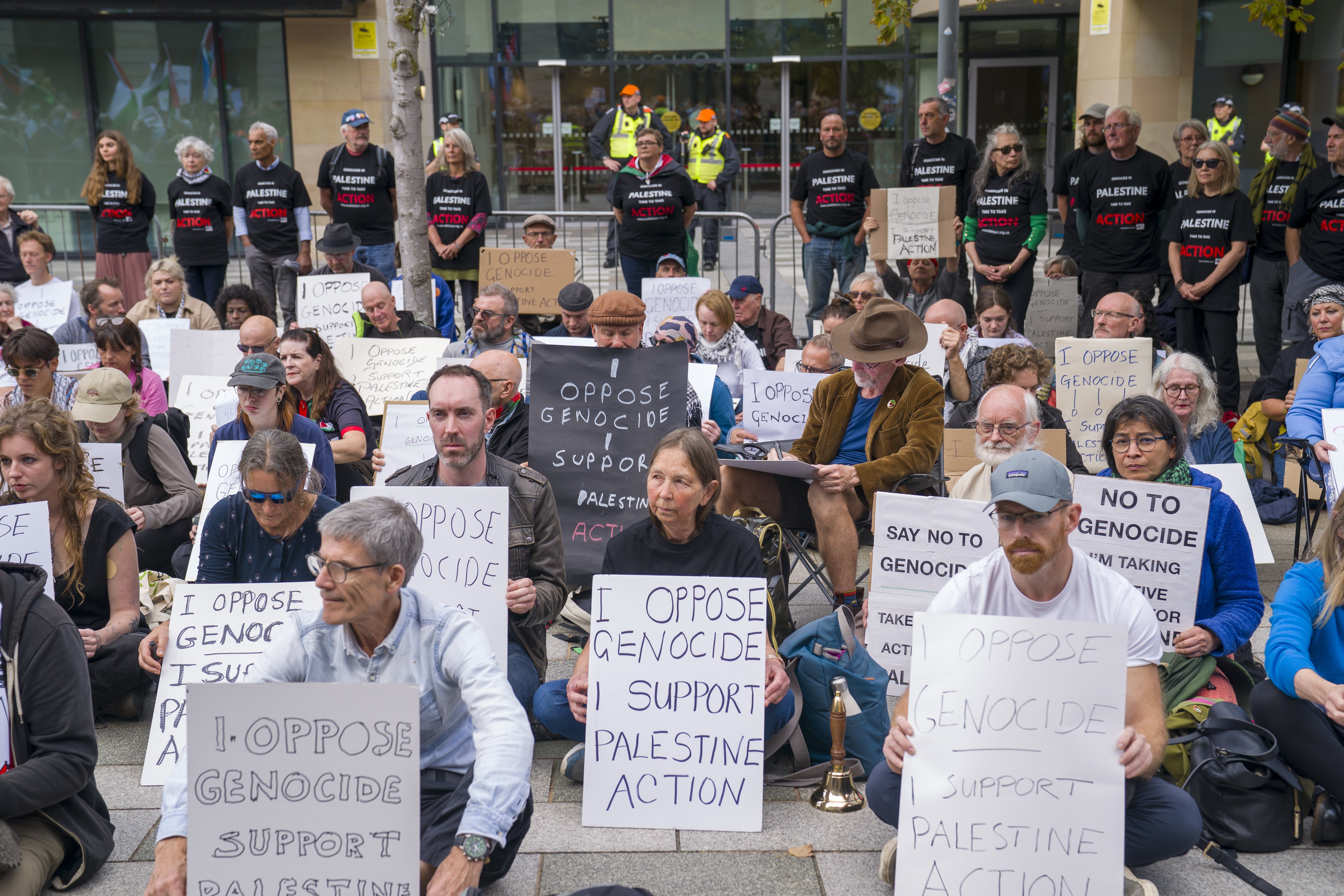 People sit outside a government building during a protest in Edinburgh back in September