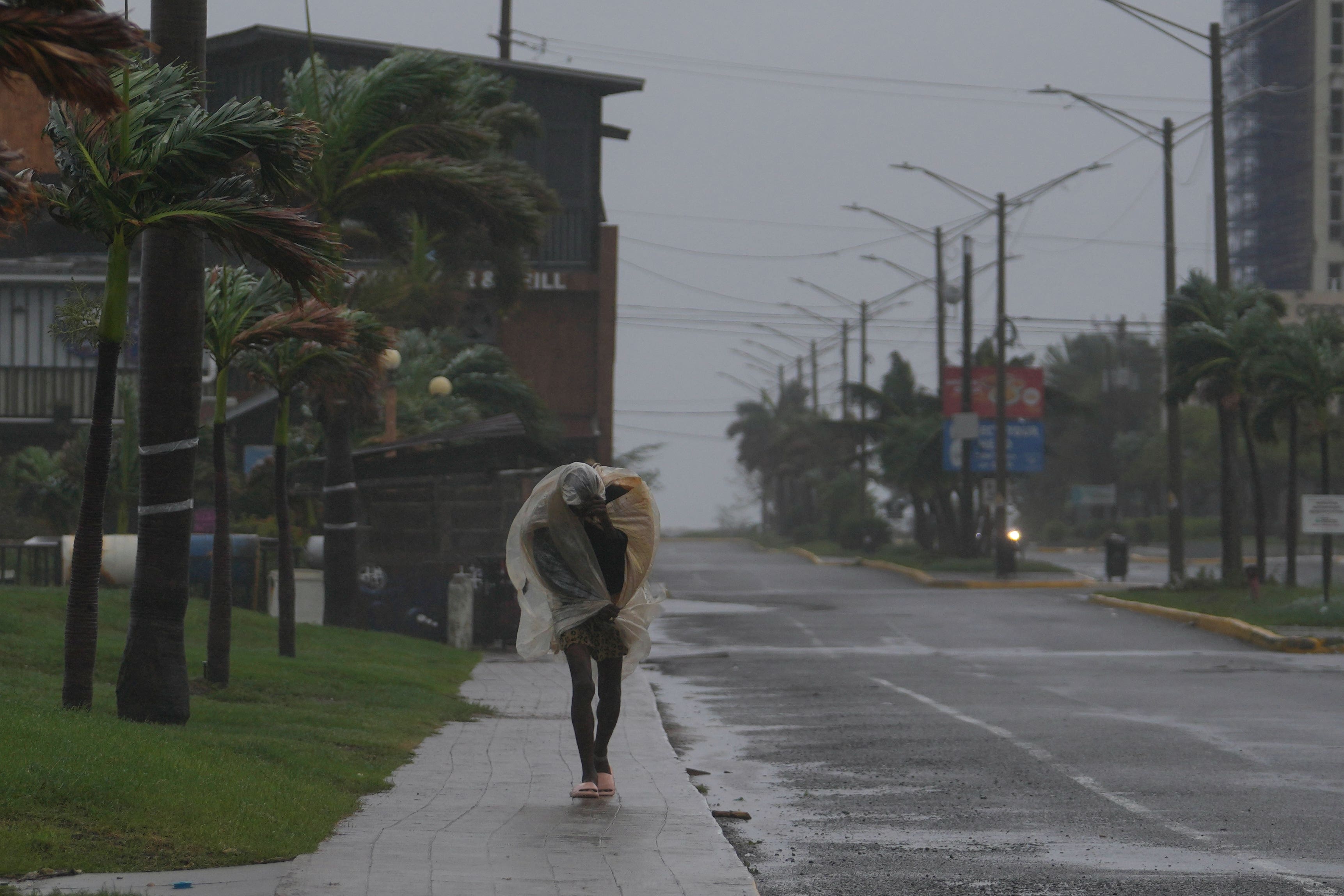 A man walks in Kingston, Jamaica, as Hurricane Melissa approaches (Matias Delacroix/AP photo)