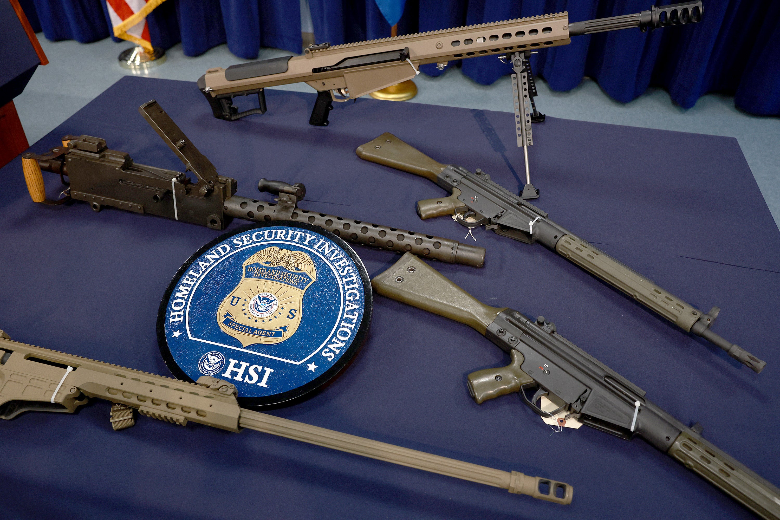 Homeland Security Investigations displays a selection of confiscated guns recovered as part of a crackdown on the smuggling of firearms and ammunition to the Caribbean at its Miami Field Office on August 17 2022