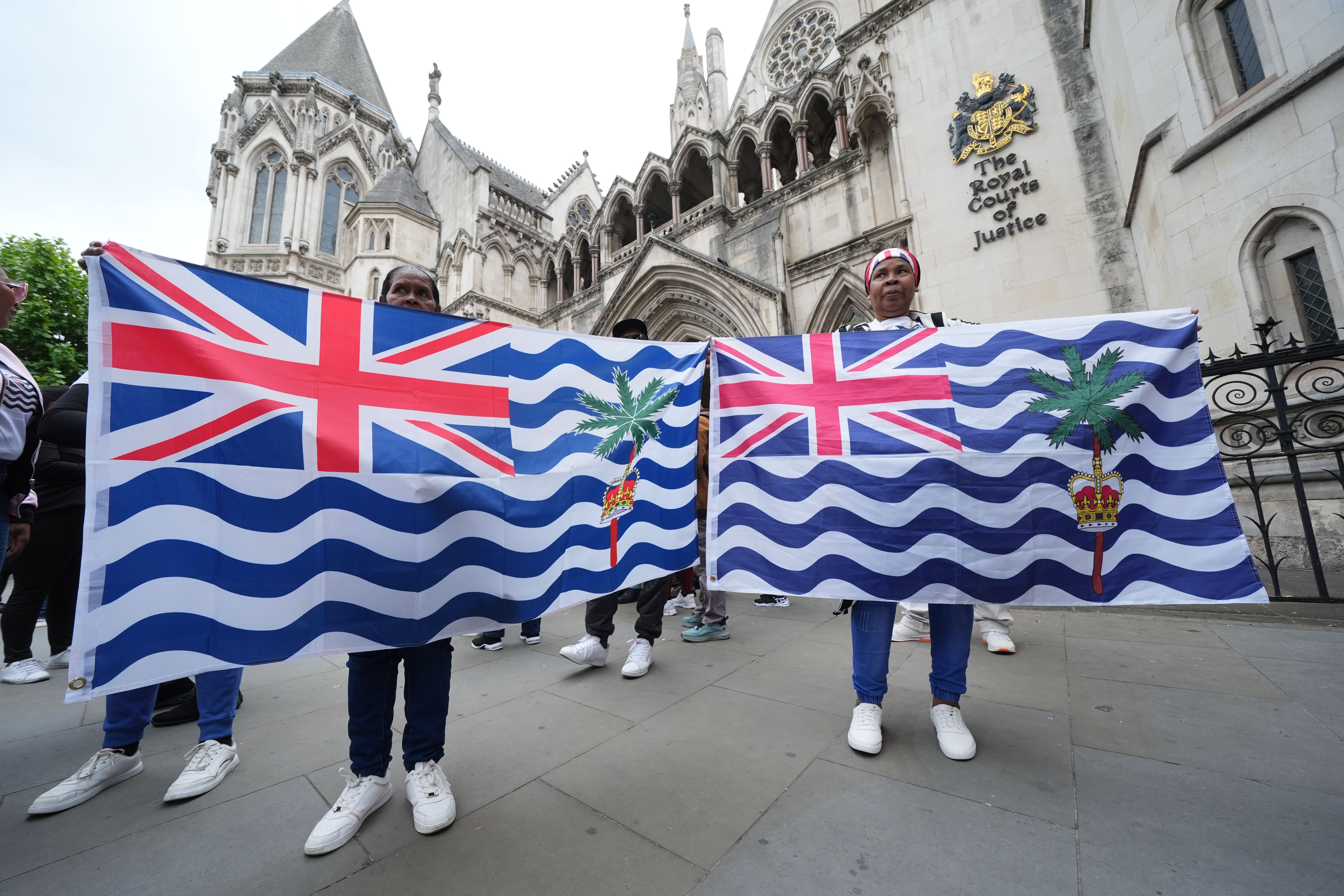 <p>Protesters outside the High Court in central London on May 22, the day the UK agreed to cede the Chagos Islands to Mauritius </p>