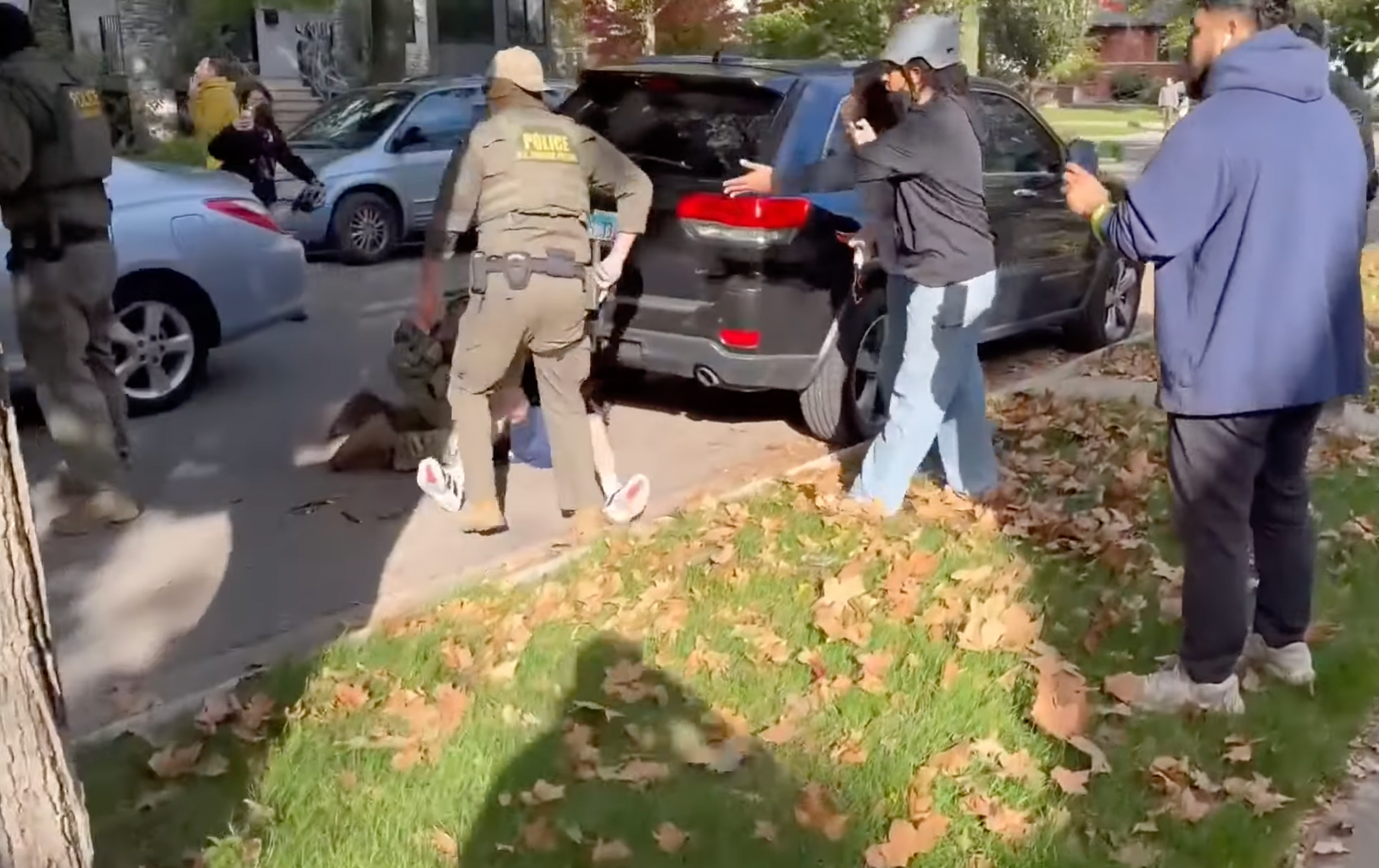Crowds gathered around the man as he was pushed to the ground by agents