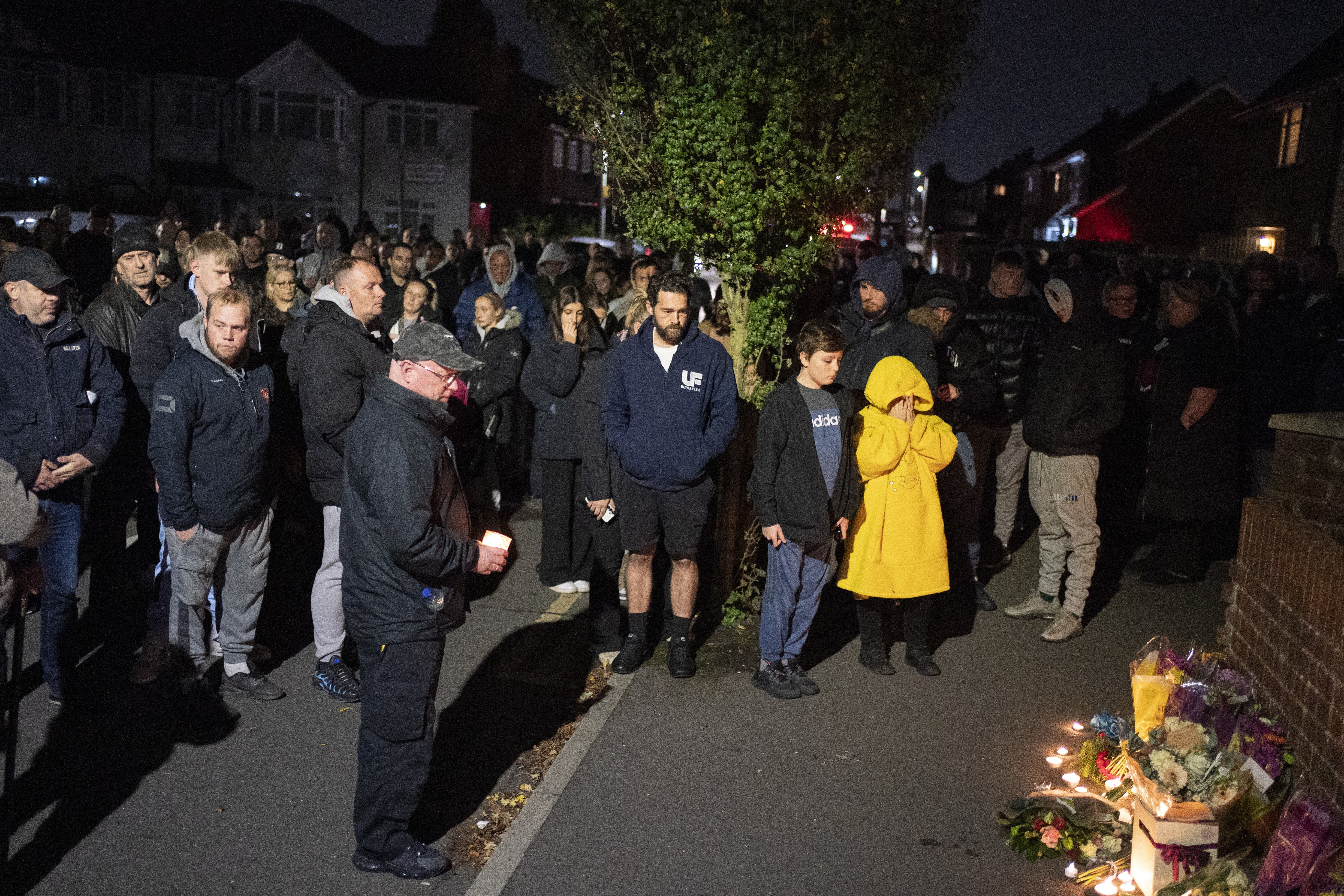 Around 100 people gathered to pay a silent tribute on Tuesday evening