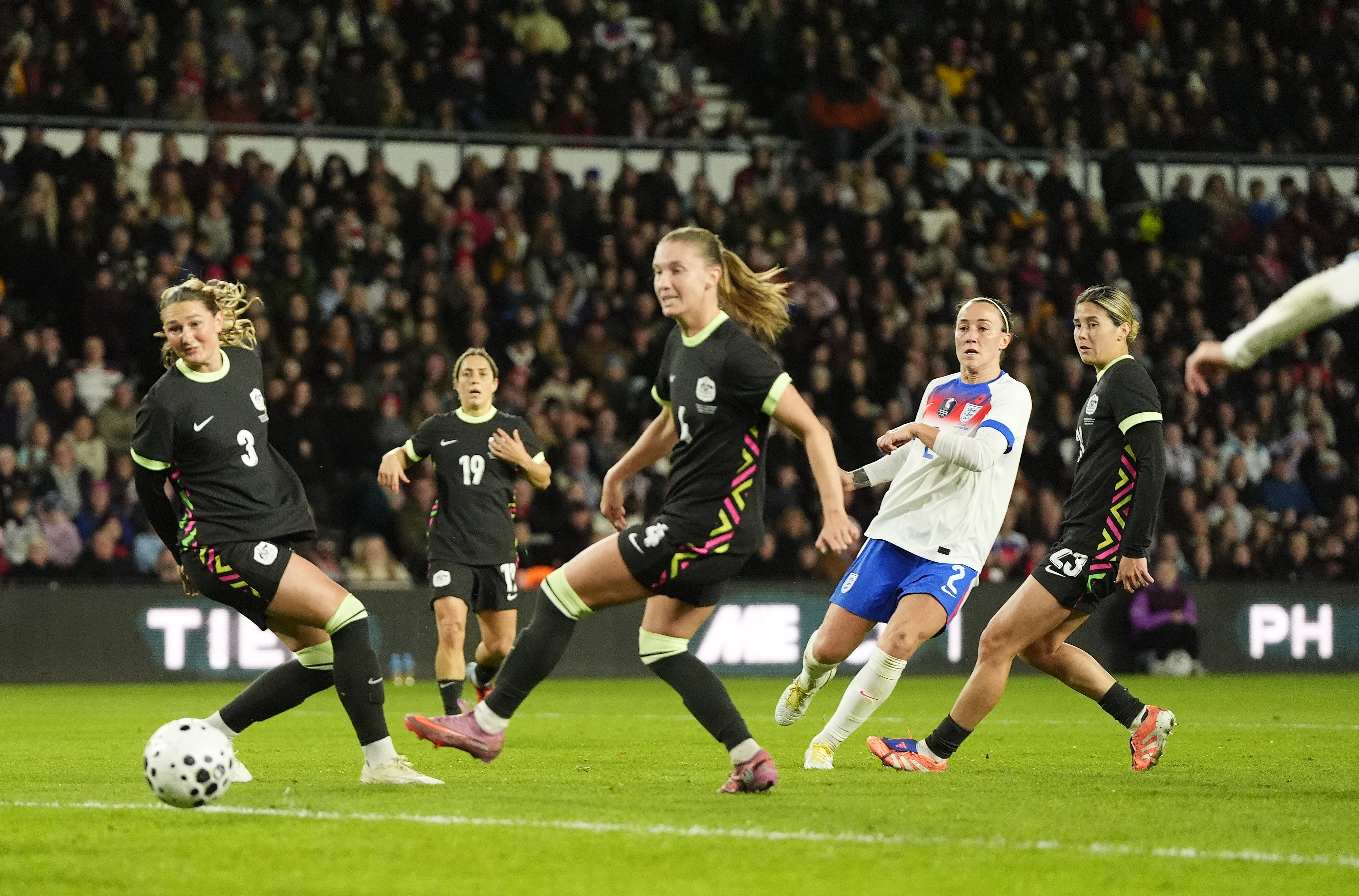 Lucy Bronze, second right, scores England’s second goal