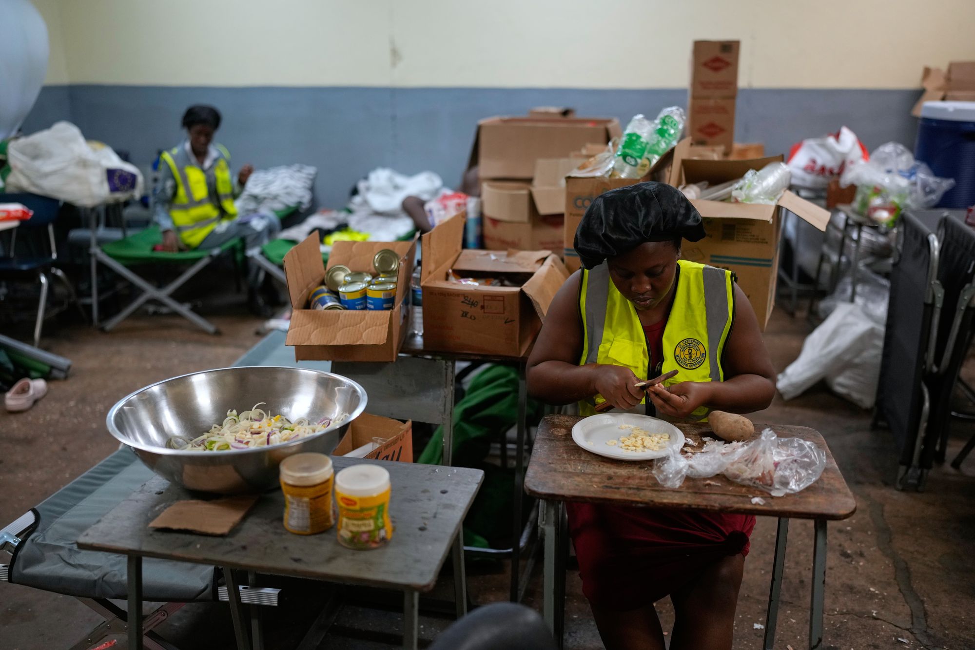 Cooks prepare meals on Monday at a shelter set up in a school ahead of Hurricane Melissa’s forecast arrival in Old Harbour, Jamaica