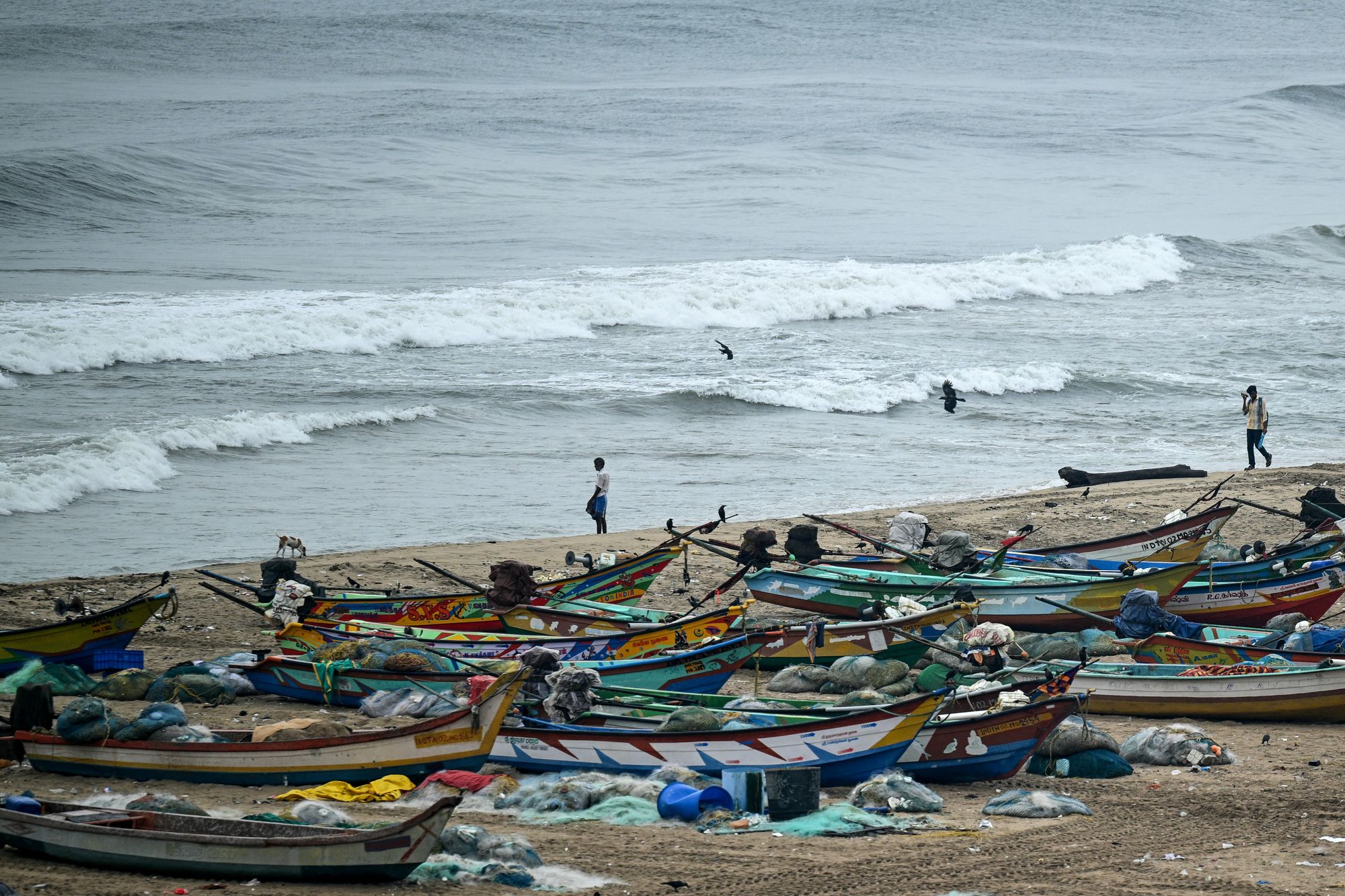Fishing boats are moored to a safer area at the Marina beach as a preventive measure ahead of Cyclone Montha in Chennai