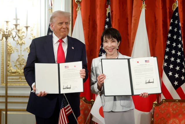 <p>US President Donald Trump and Japan's Prime Minister Sanae Takaichi pose during a signing ceremony for a document on the implementation of the US-Japan trade deal at the Akasaka State Guest House in Tokyo</p>