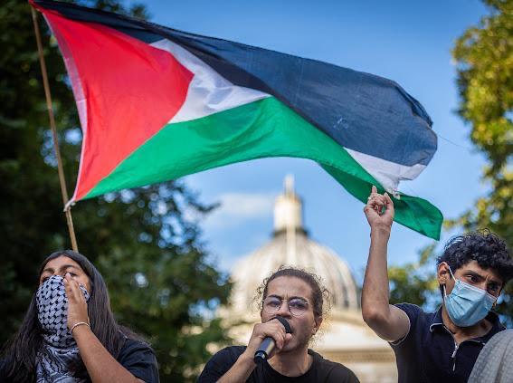 Ghanem (centre) giving a speech at pro-Palestine protest in Central London