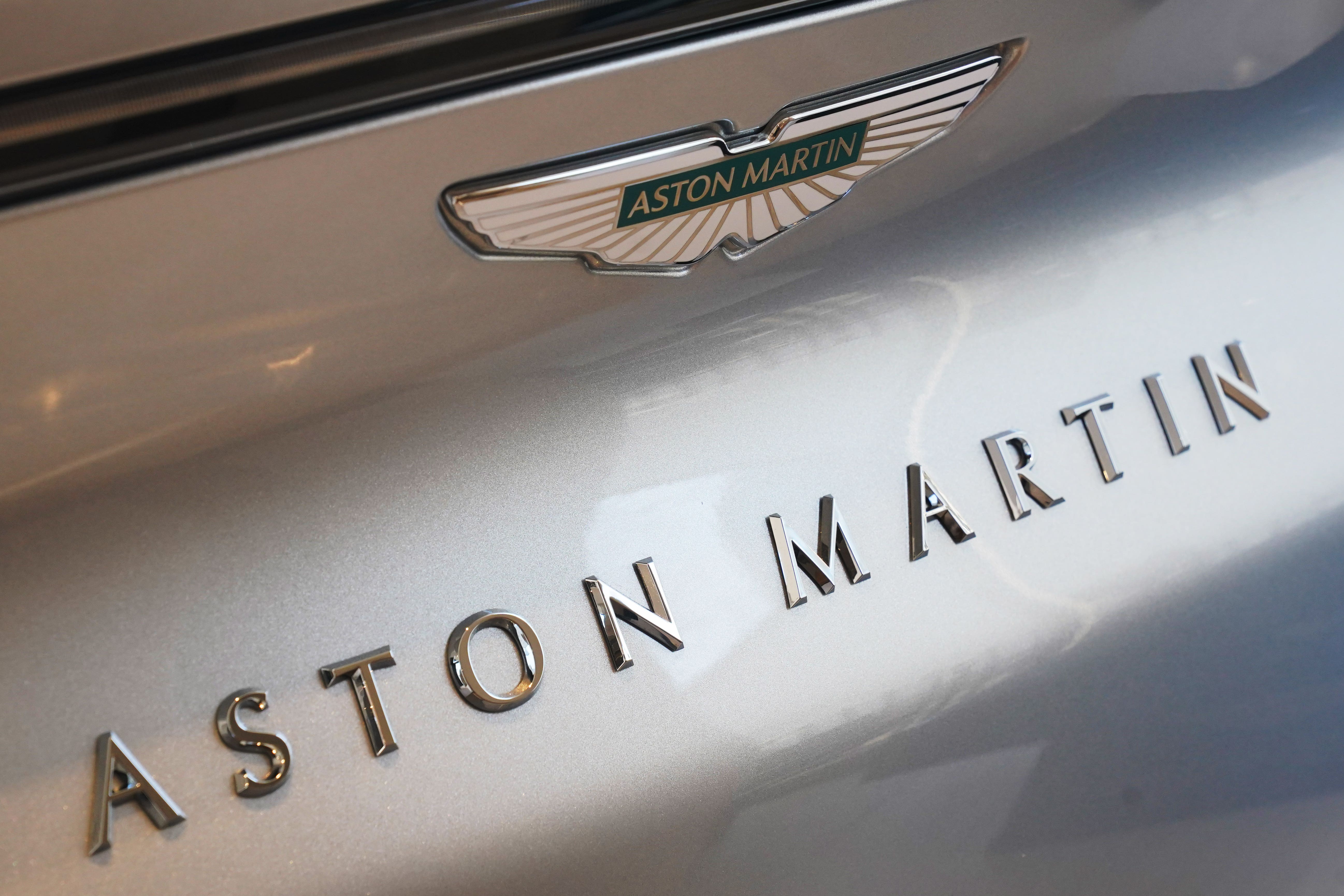 Aston Martin Lagonda told shareholders it will cut its five-year investment commitment from £2 billion to £1.7 billion
