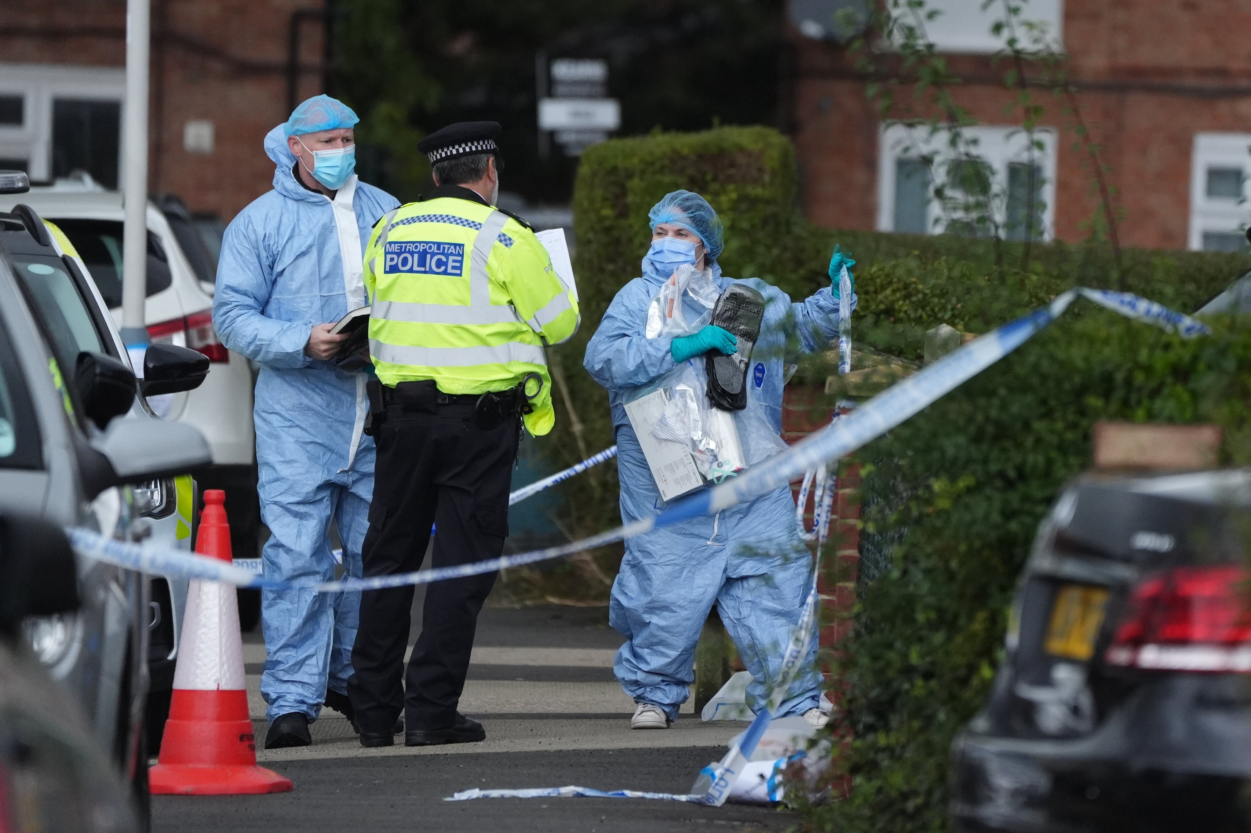 Forensic officers in Midhurst Gardens in Uxbridge, west London