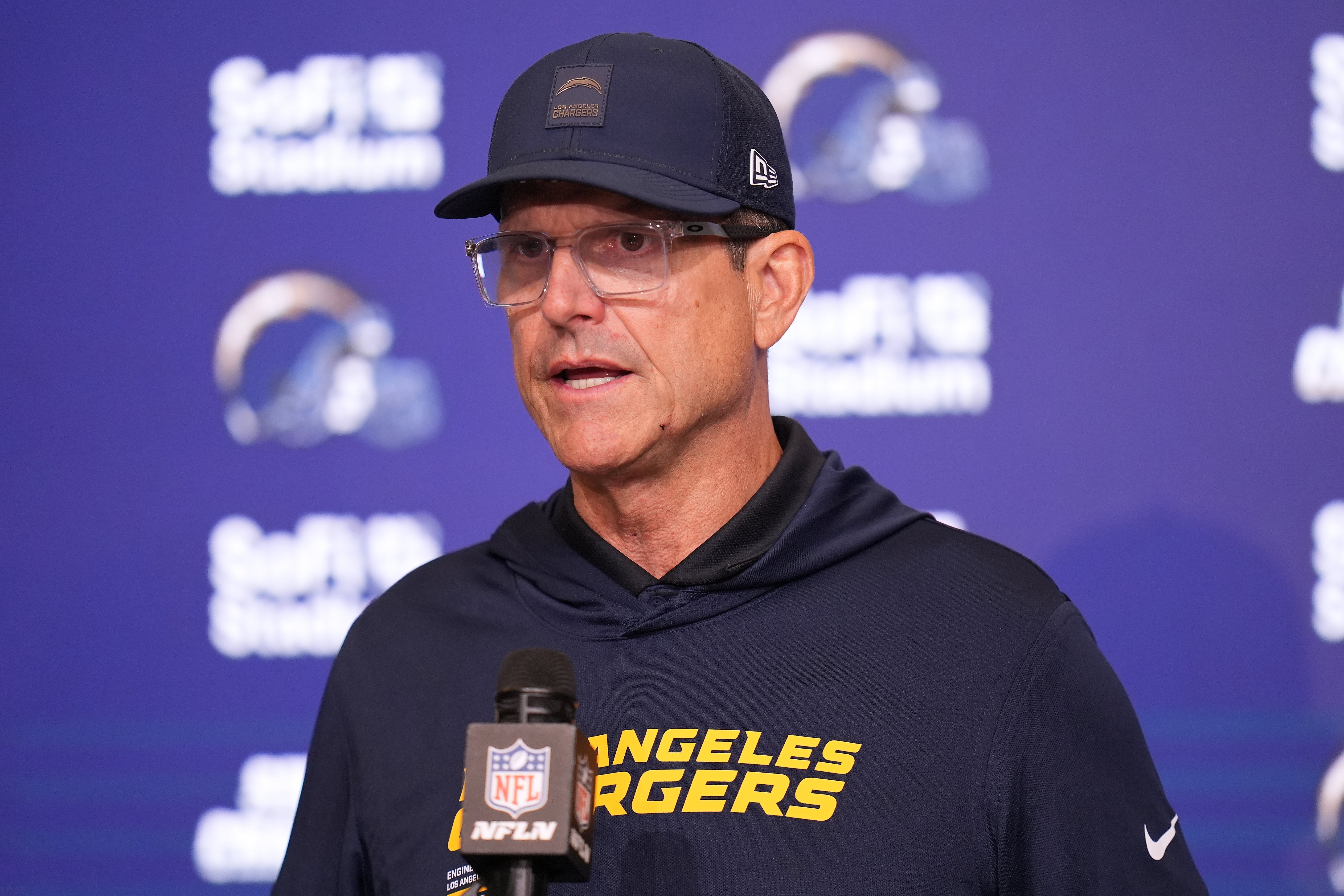 Jim Harbaugh praised Herbert for playing on through the pain barrier