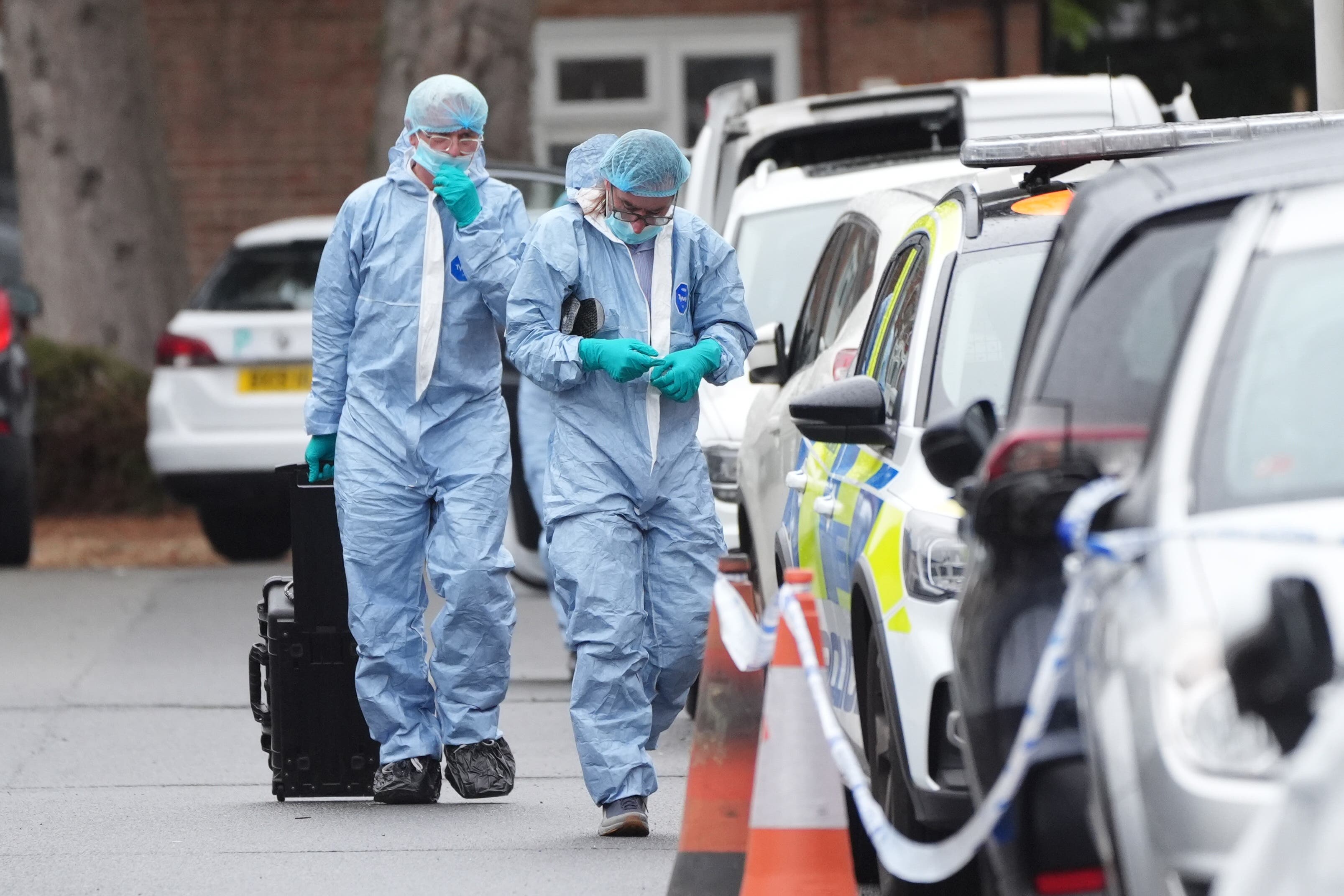 Forensic officers on the scene in Midhurst Gardens, Uxbridge
