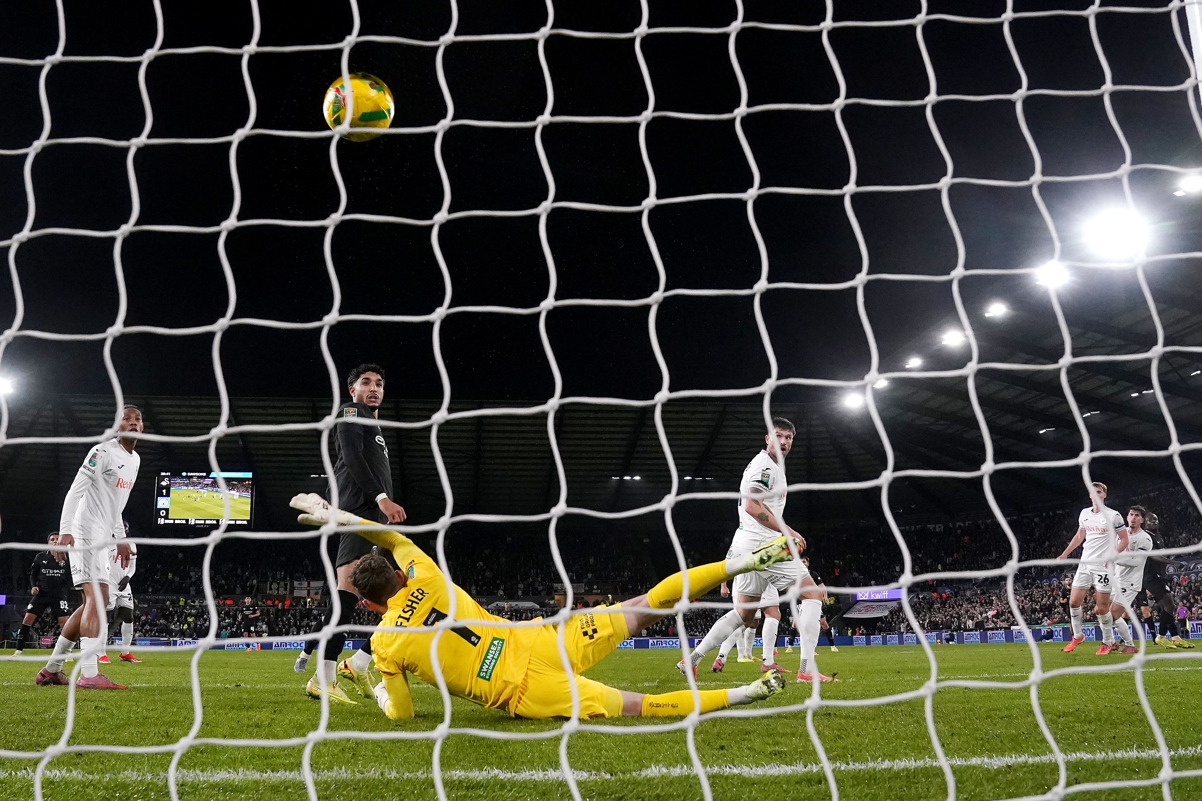 Manchester City’s Jeremy Doku (right) equalised in their Carabao Cup victory at Swansea