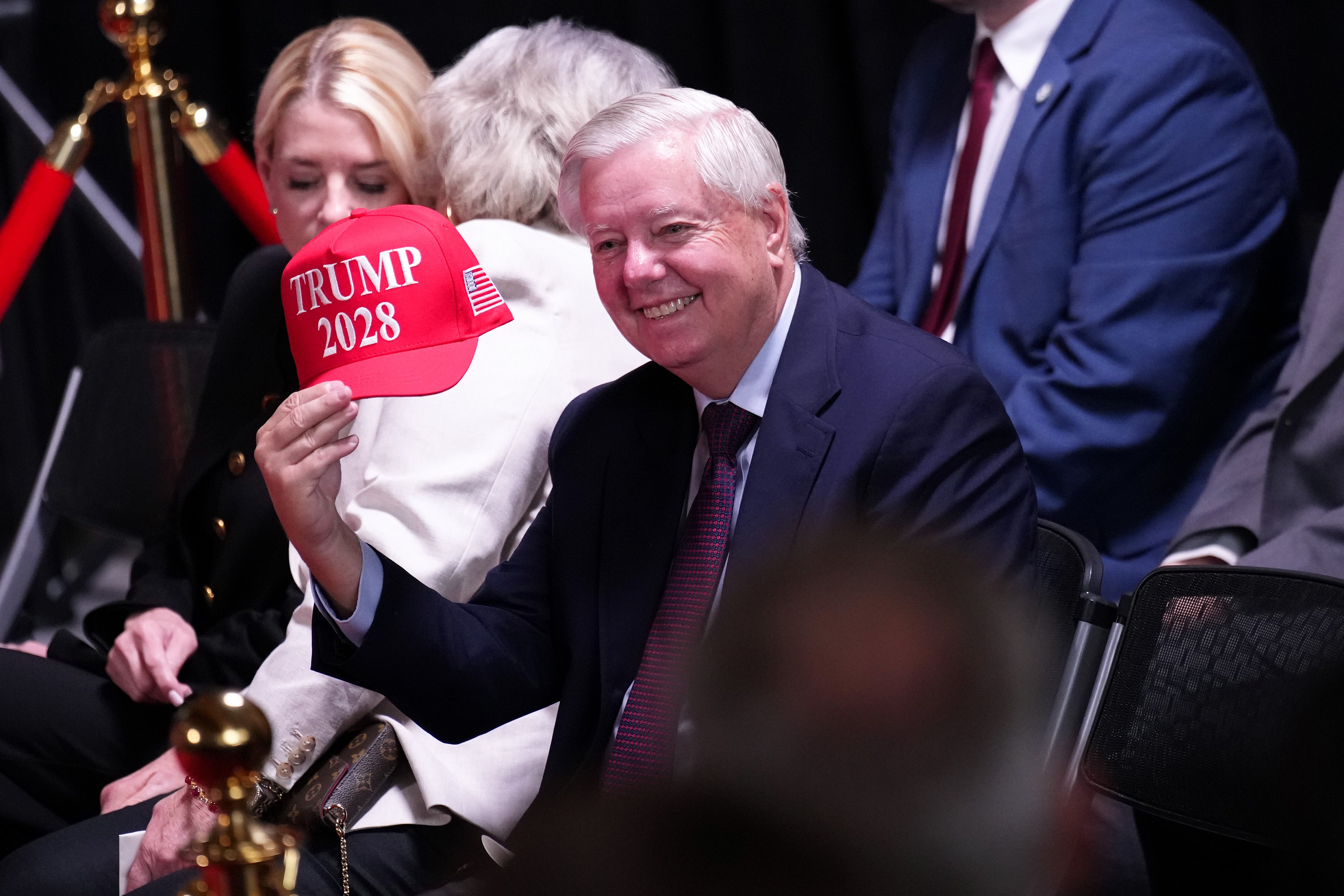 The president has repeatedly entertained the idea of running for a third term, which has included Trump 2028 hats including the one Senator Lindsey Graham, a South Carolina Republican, is holding in this photo