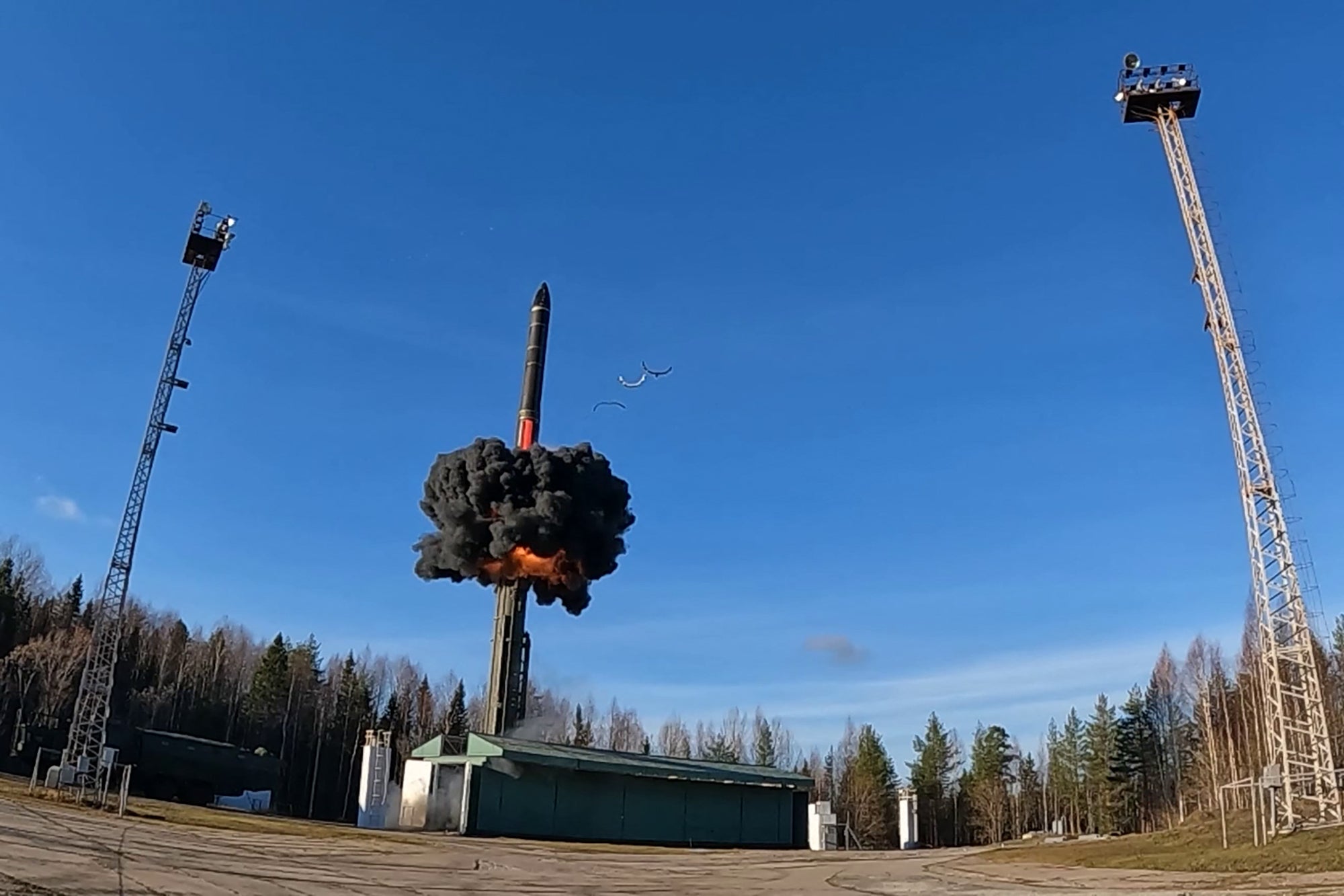 Footage released by the Russian Defence Ministry October 22 shows the launch of an intercontinental ballistic missile at Plesetsk testing field in northern Russia during drills of the country's nuclear forces