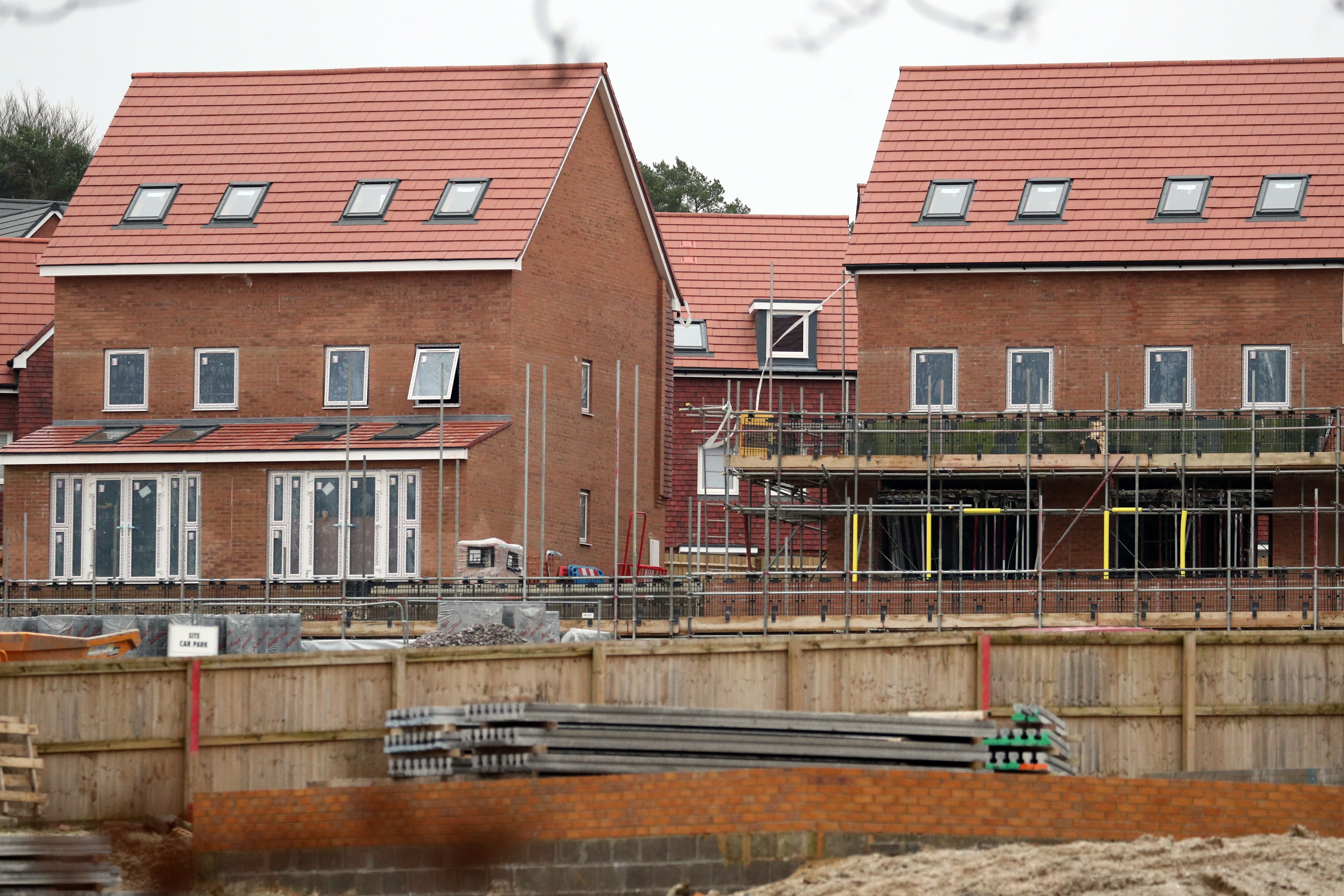 Homes under construction on a housing development (Andrew Matthews/PA)